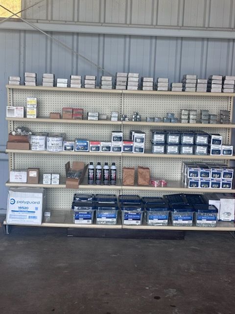 Shelves of stacked product boxes and bottles in a warehouse or storage area