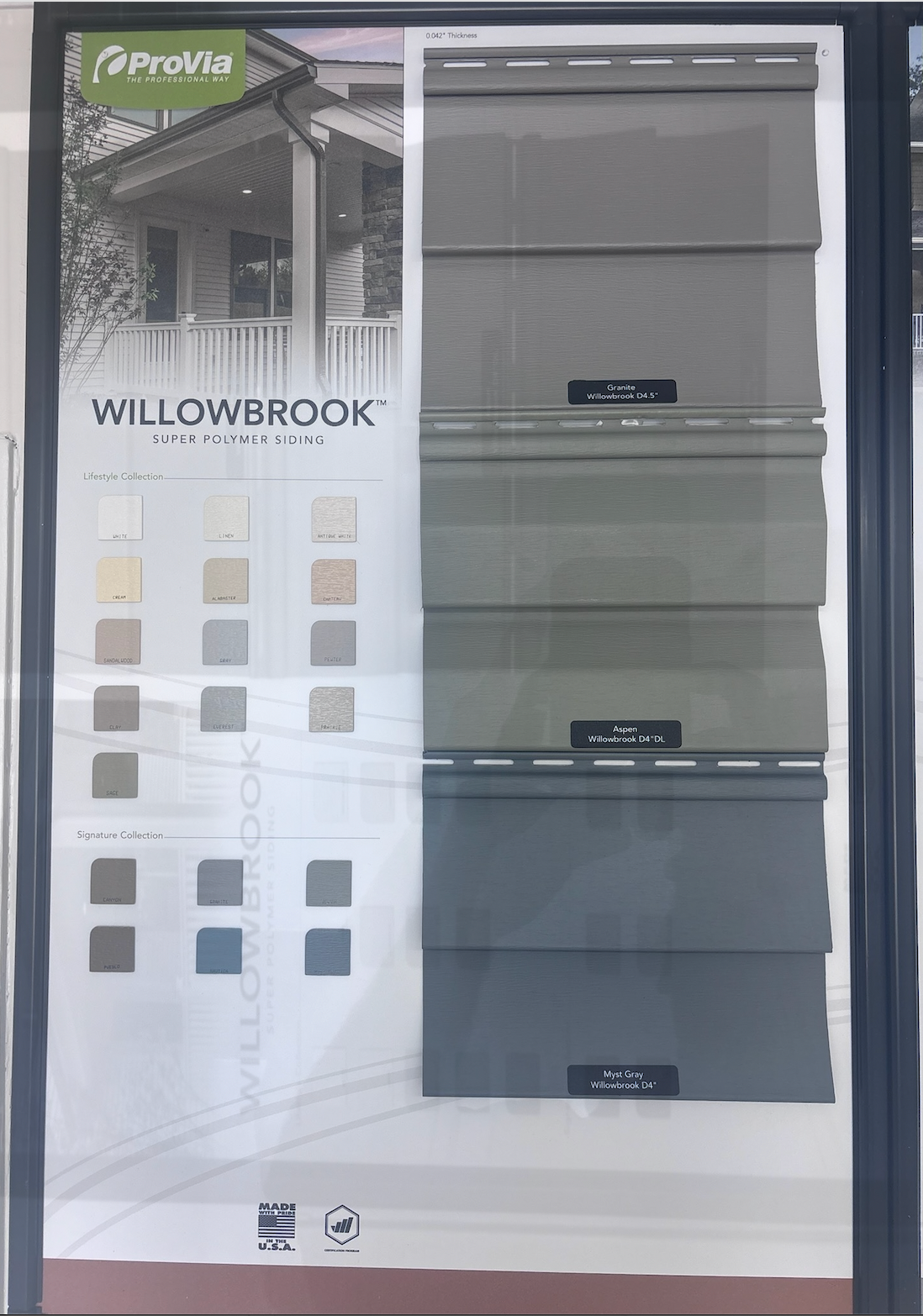 Flooring display board with gray panels and sample swatches labeled Willowbrook.