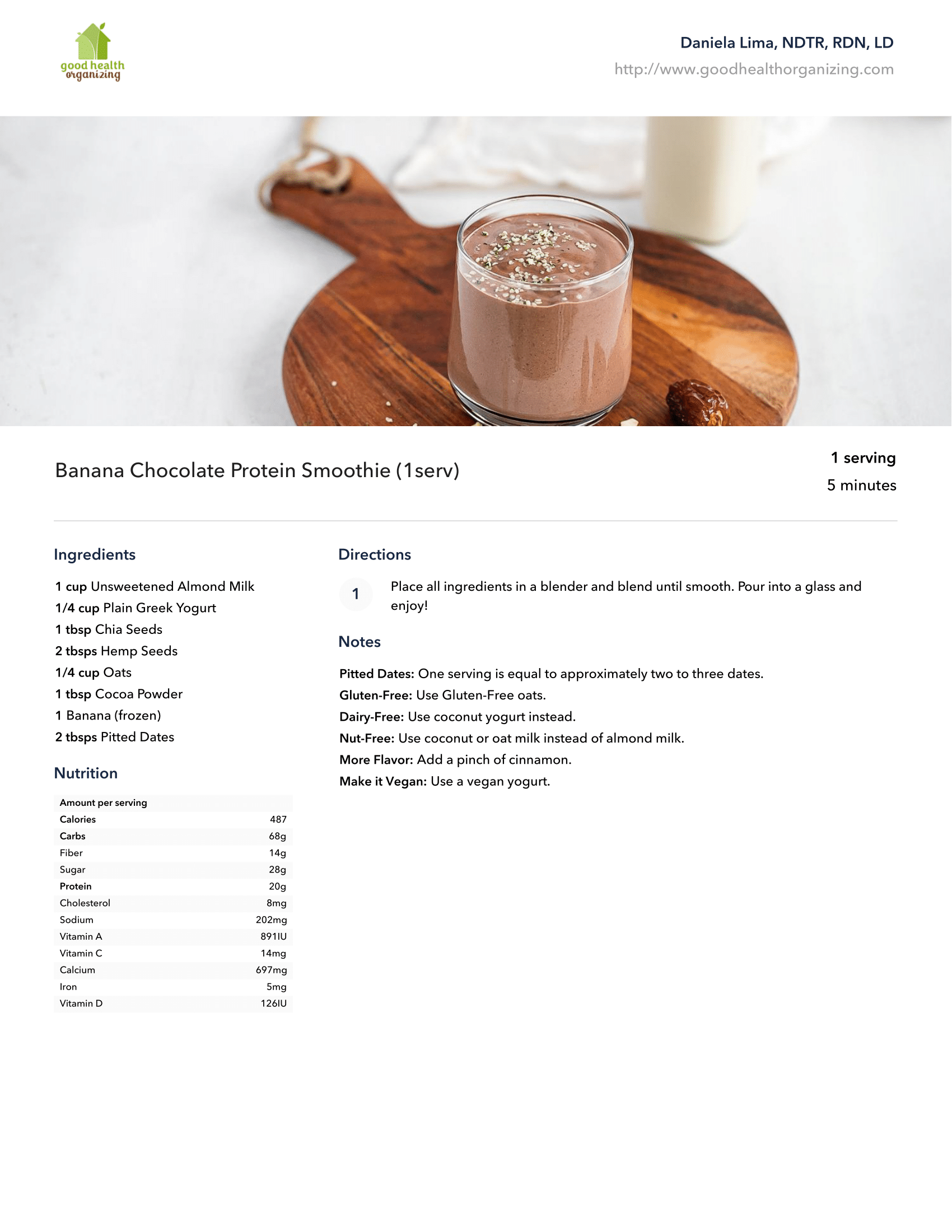 A chocolate smoothie is sitting on a wooden cutting board.