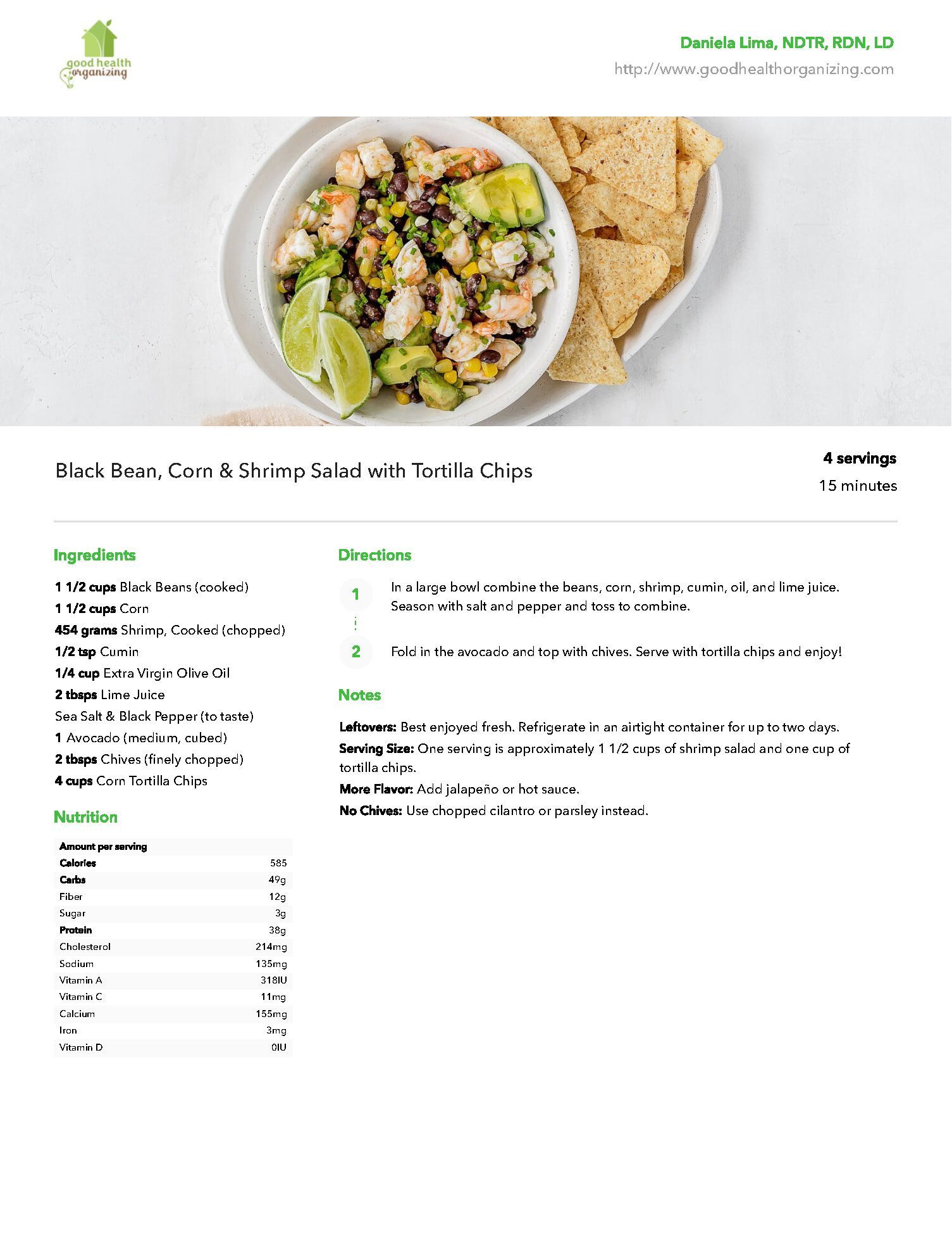 A white plate topped with a bowl of food and tortilla chips.