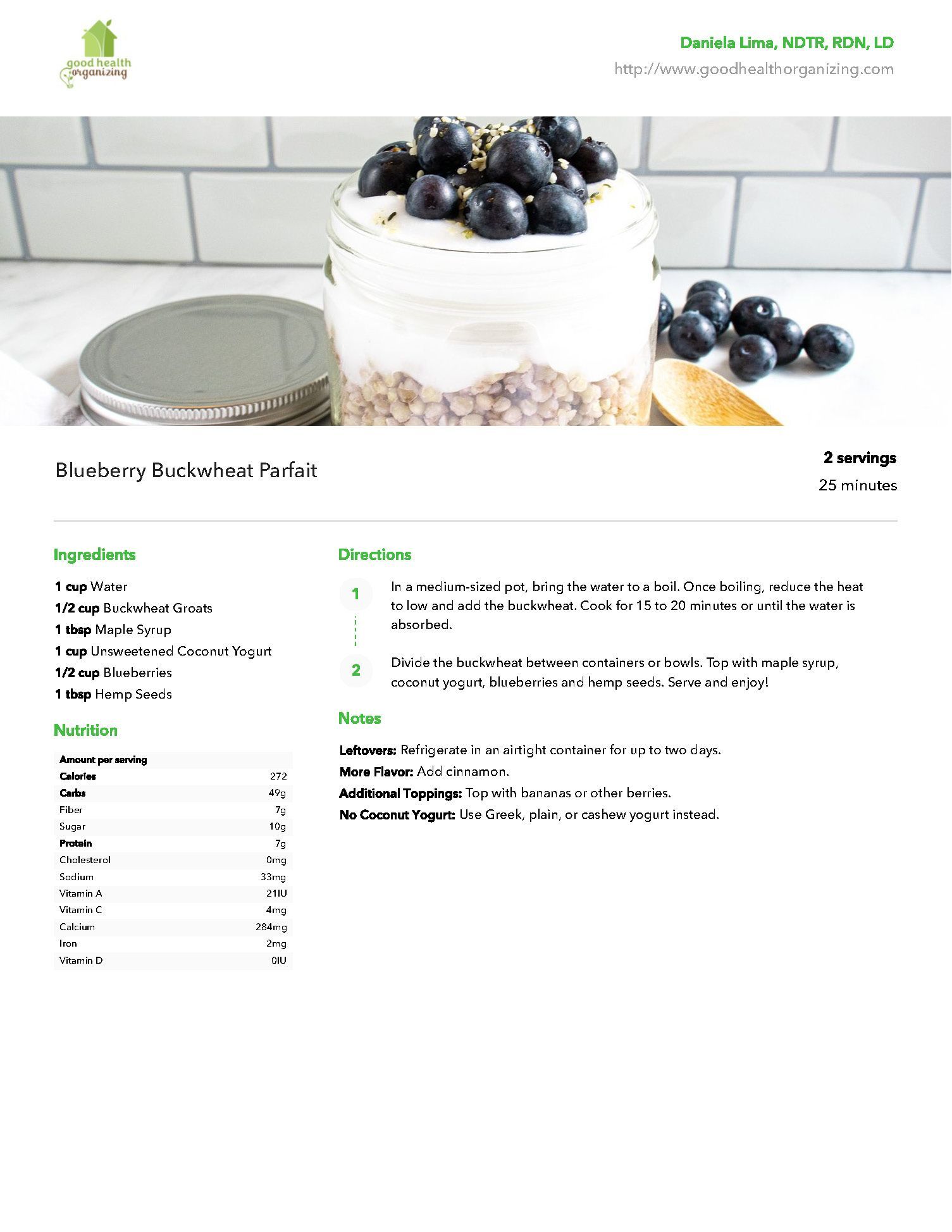 A jar filled with oatmeal and blueberries on a table.