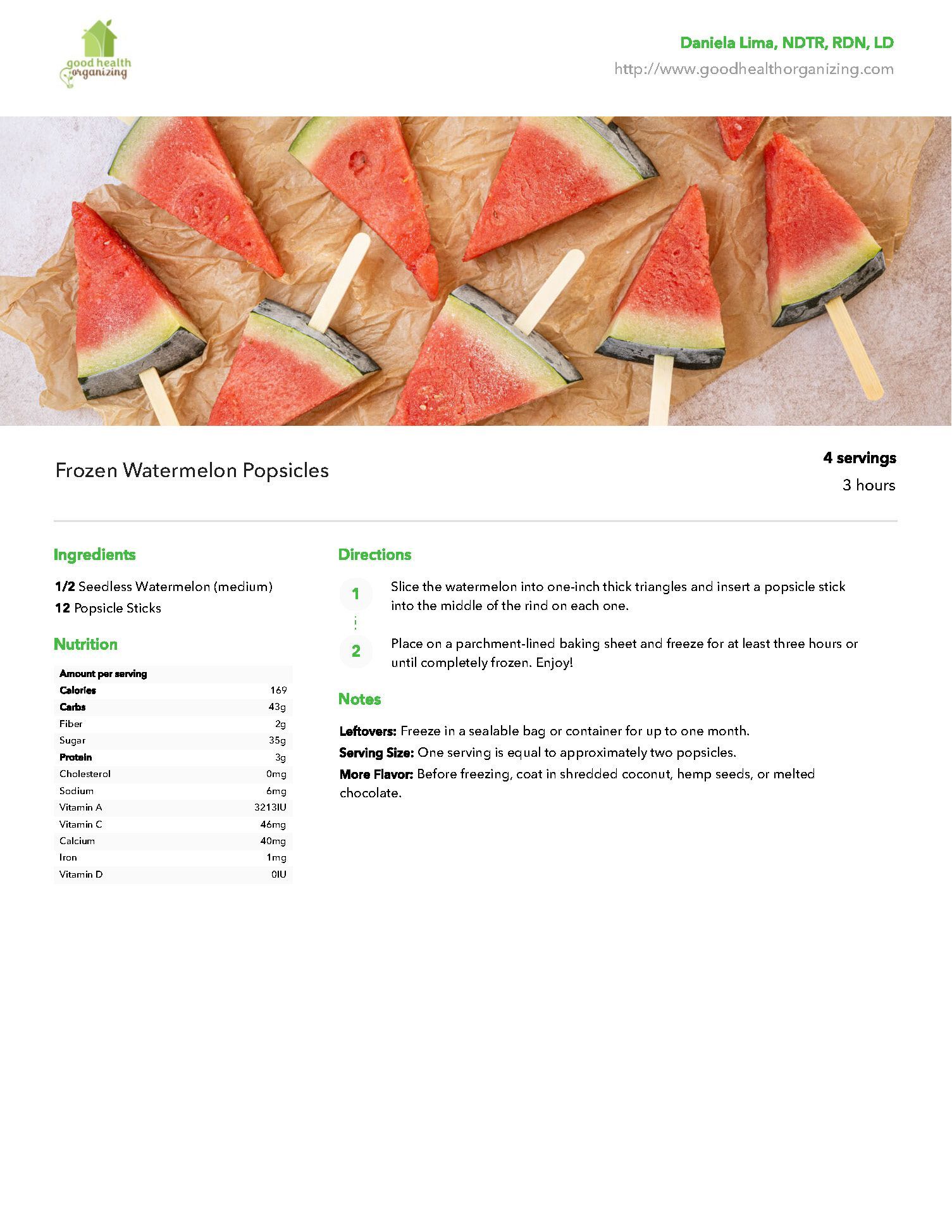 A bunch of watermelon slices on sticks on a table.