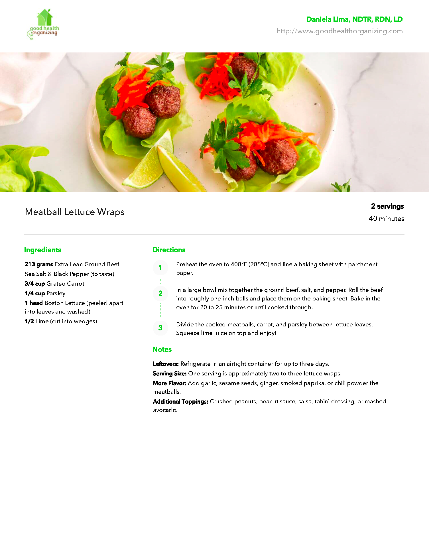 A plate of food with meatballs and lettuce on a table.