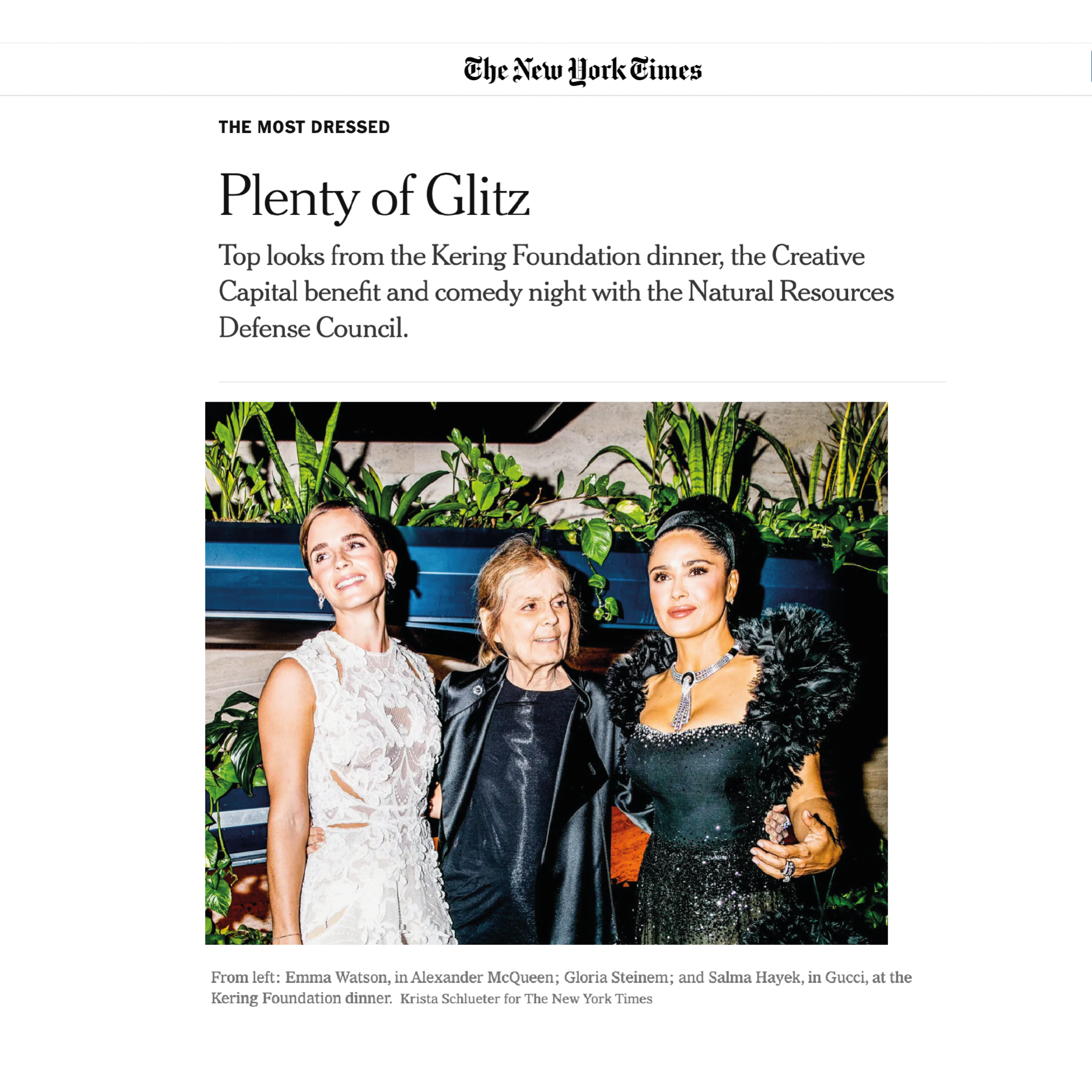 Three women are standing next to each other on the cover of a magazine.