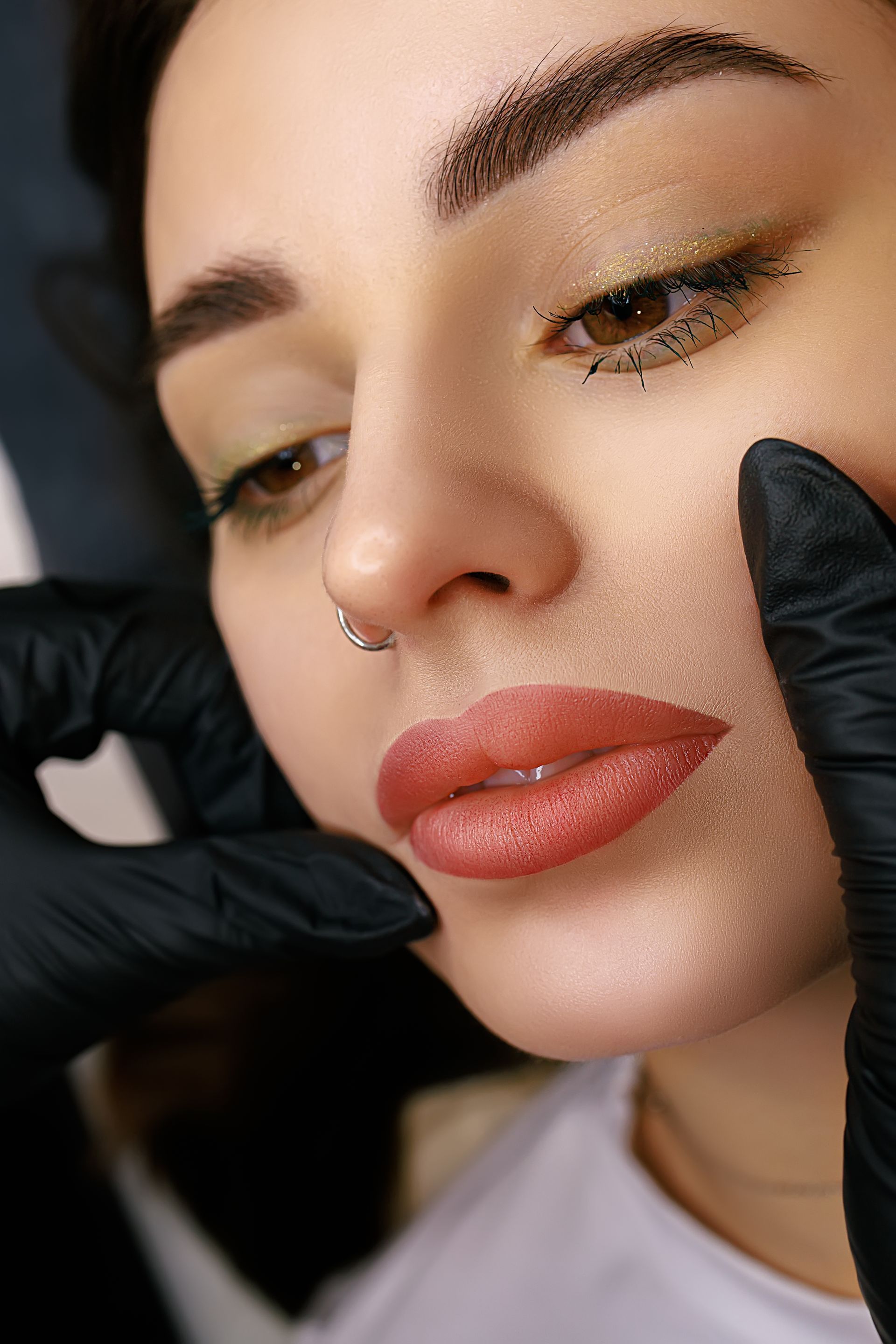 a close up of a woman 's face with permanent lip blush