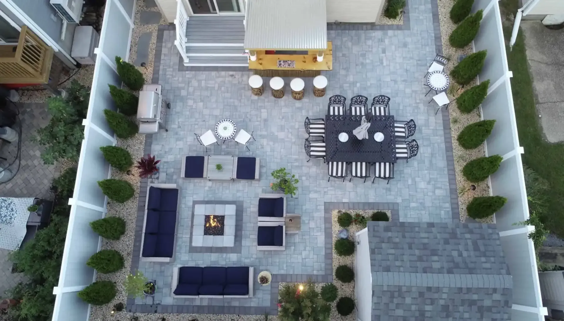 Masonry Services | Libardi Island Landscaping Corp. An aerial view of a backyard with a table and chairs.