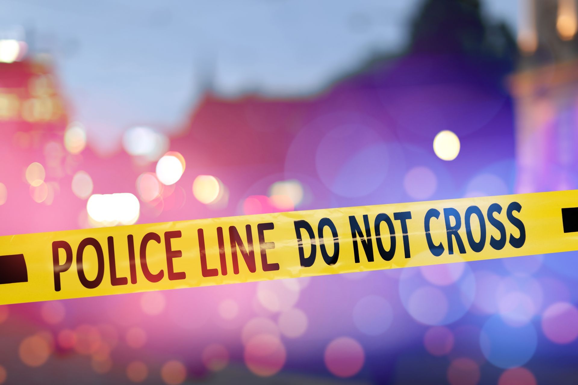 A close up of a police line do not cross tape.