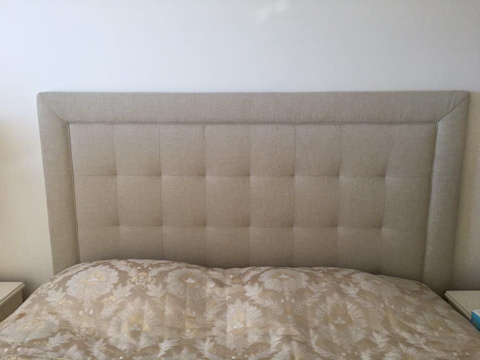 A Bed With a Headboard and a Blanket on It in a Bedroom — Custom Unique Trimming in Mackay, QLD