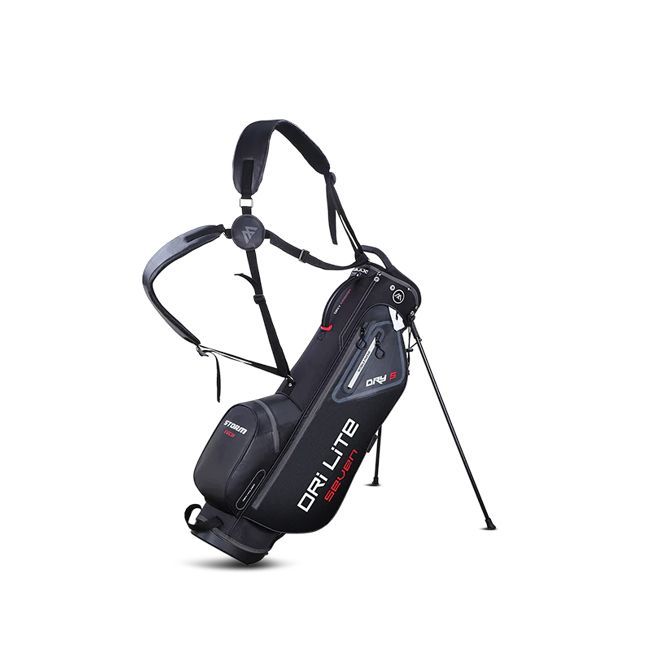 Black and red golf stand bag with dual shoulder straps, propped on its legs.