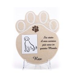 A paw-shaped memorial plaque for a dog named Rex, featuring a dog illustration and the Italian inscription