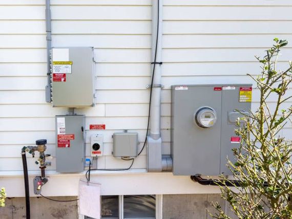 Electrical panels and meter installed on exterior wall