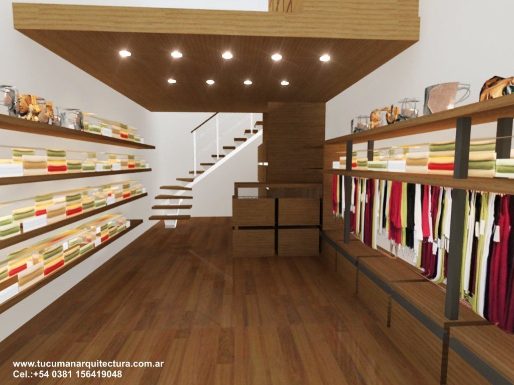 Vestidor moderno con suelos de madera, estantes, perchero y una escalera en la parte trasera.
