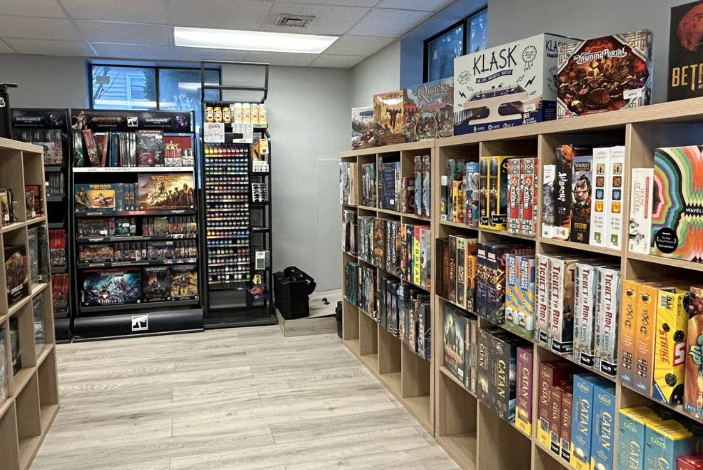 A room filled with shelves filled with lots of board games.