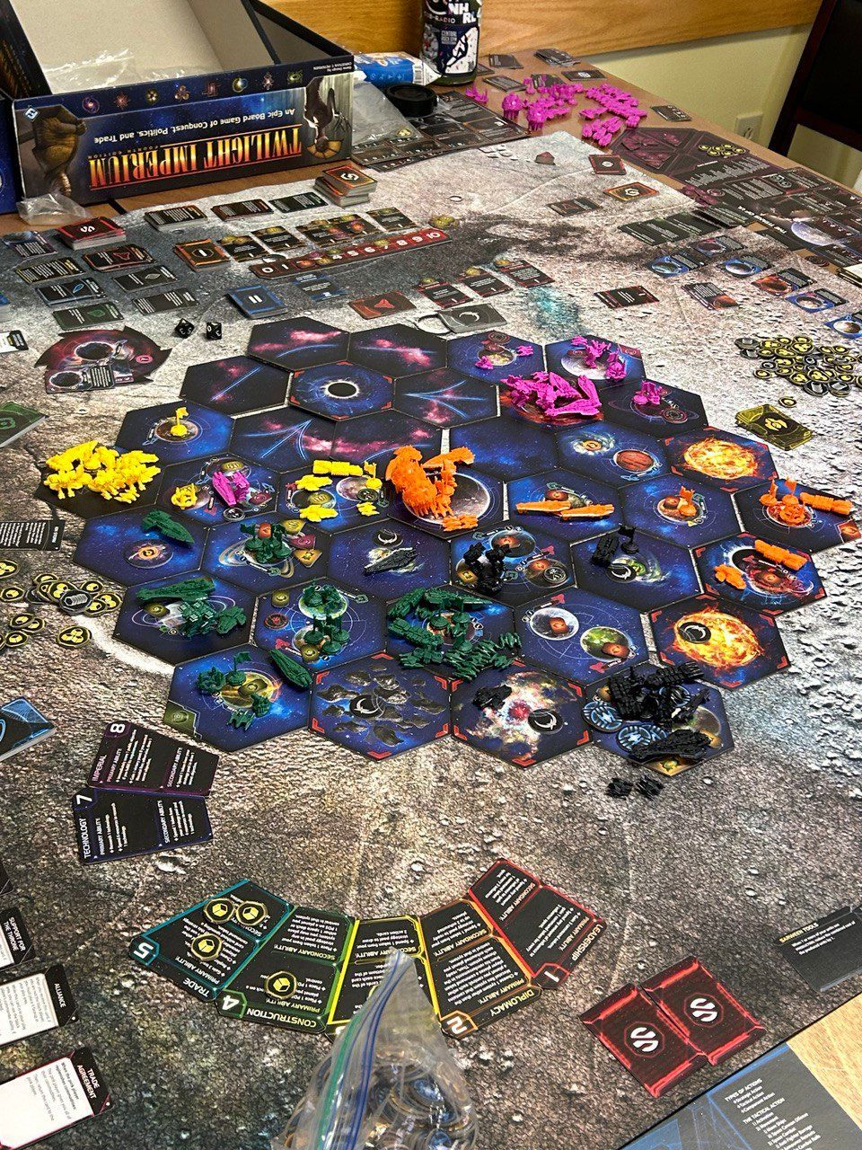 A board game is being played on a table.