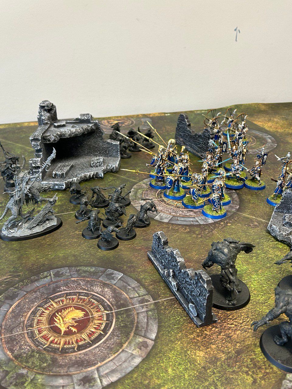 A table topped with a bunch of miniature figures.