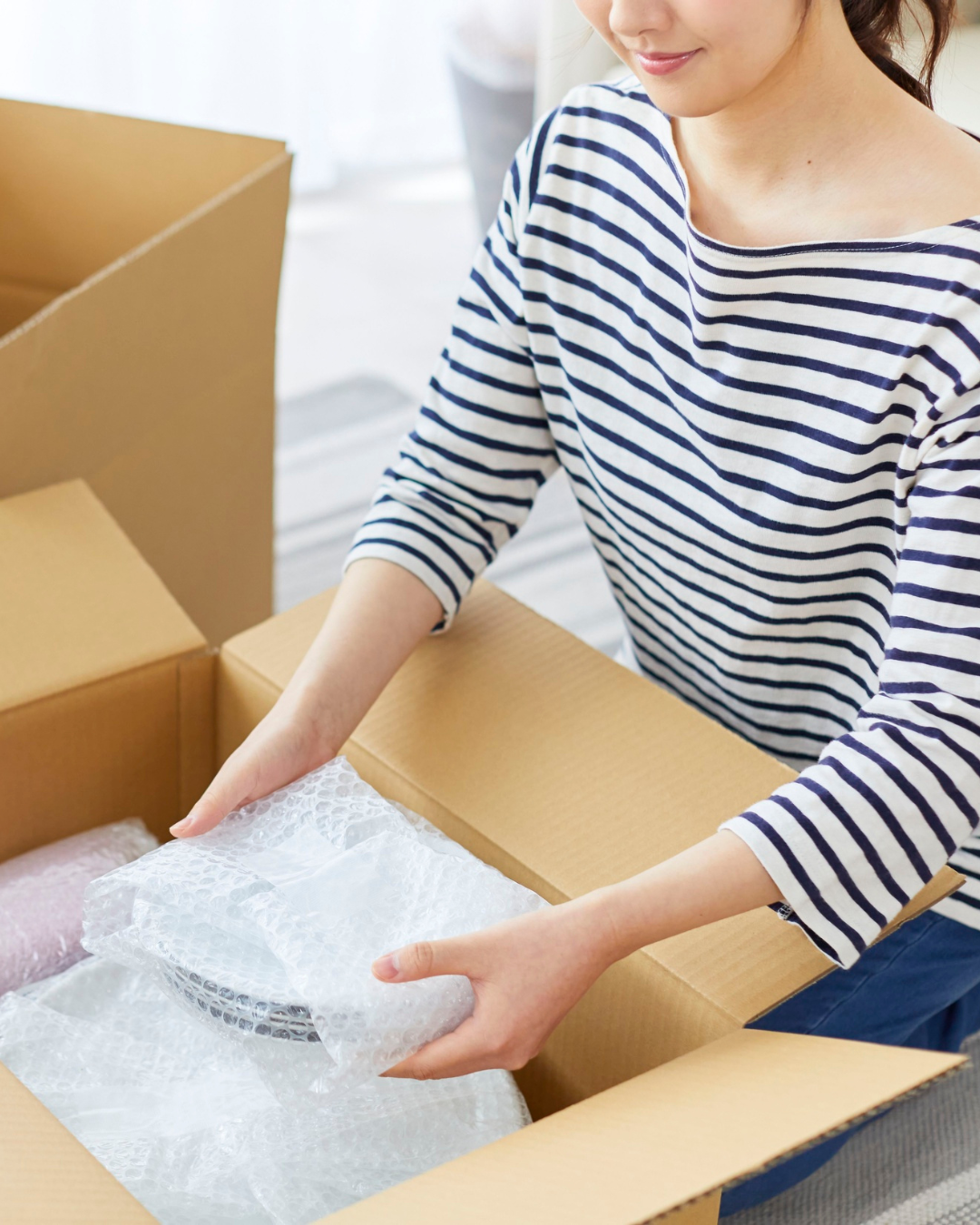 Woman packing a box 
