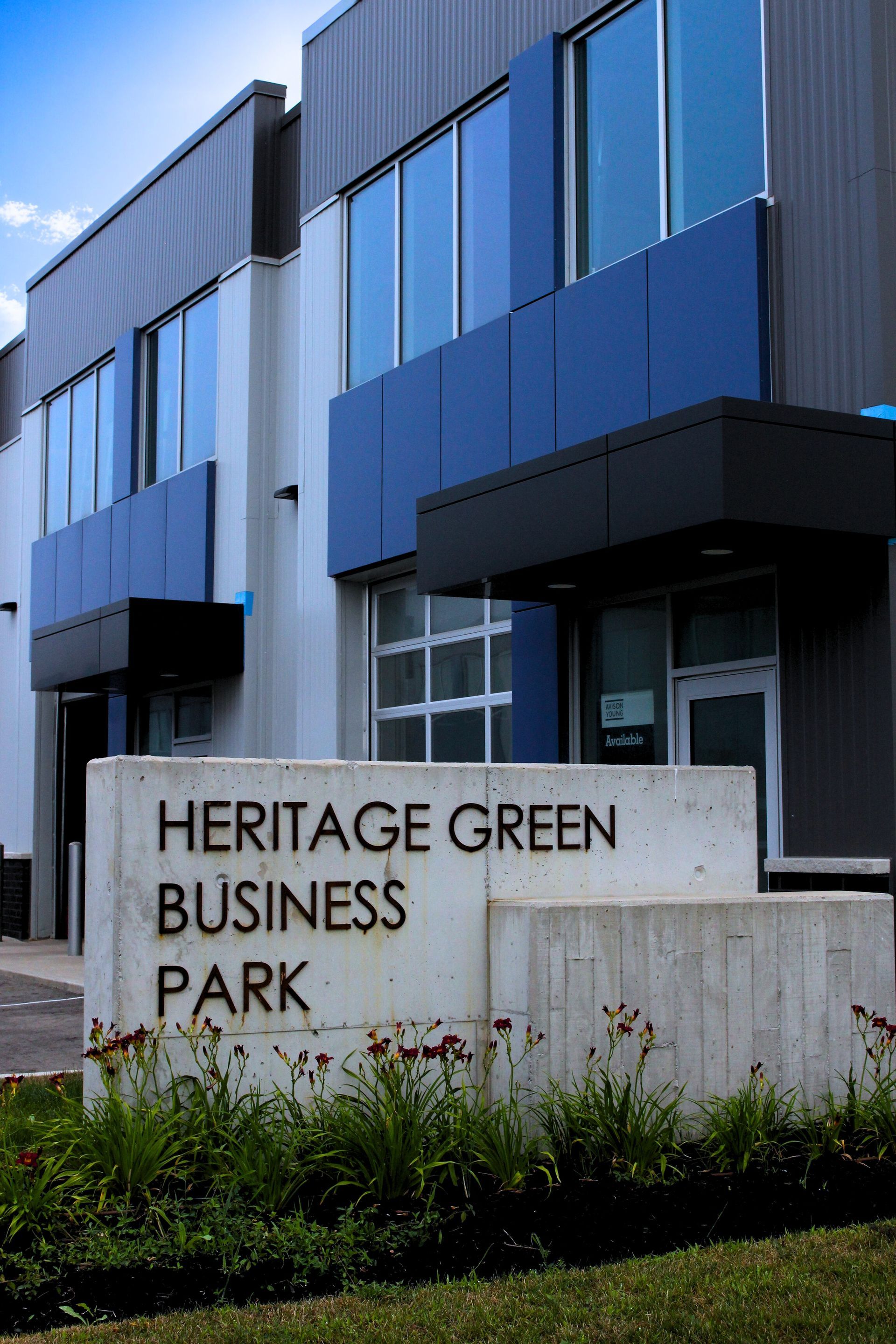 The front entrance sign that says heritage green business park