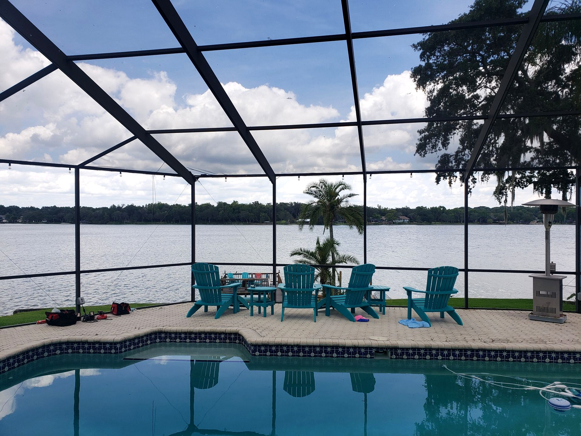 waterfront mansard pool enclosure installation in Lakeland, FL.