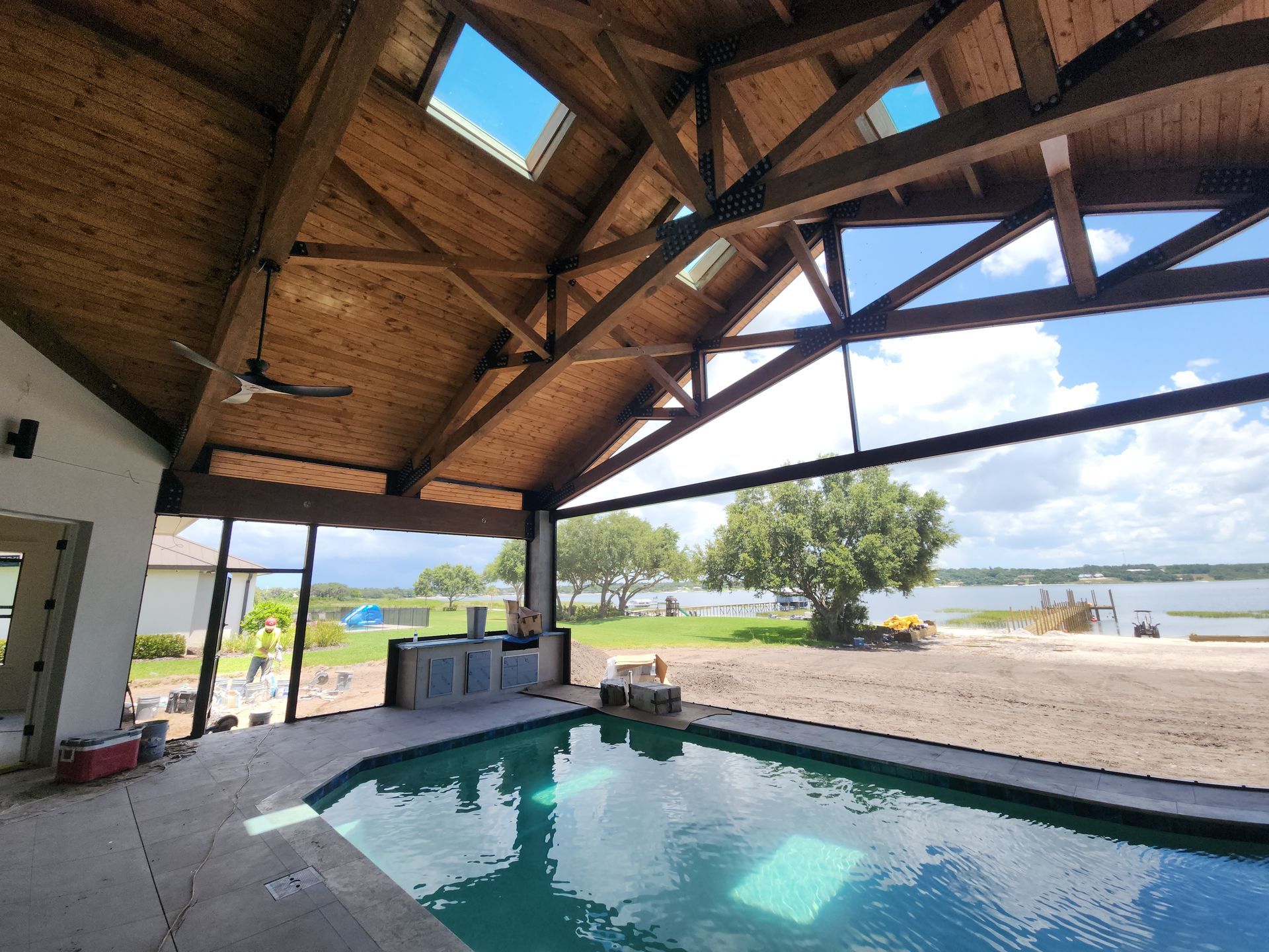 timber frame pool enclosure roof with wood ceiling installation in Lakeland, FL.