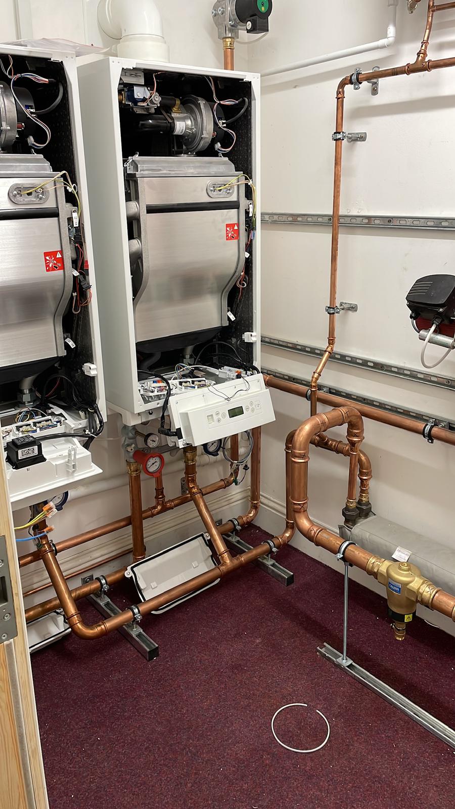 Gas Safe engineer servicing a domestic boiler in Wokingham home