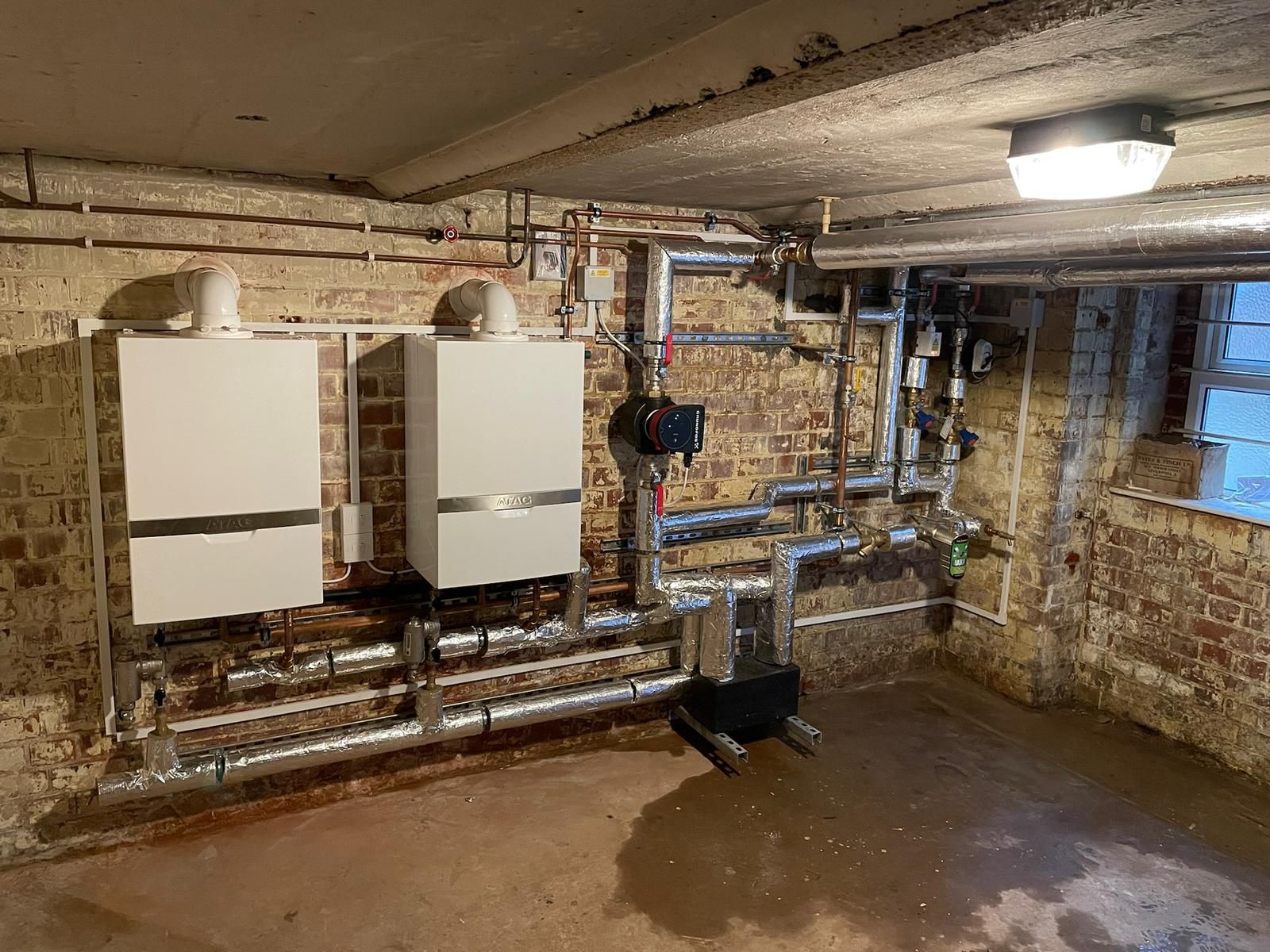 Gas Safe engineer installing a commercial boiler in Reading plant room