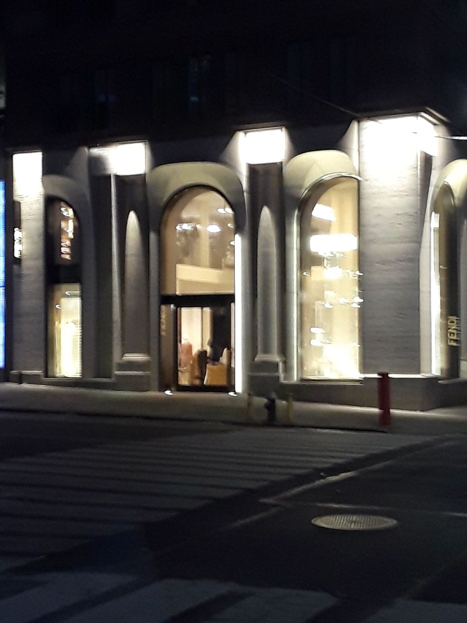 A building with a fire hydrant in front of it