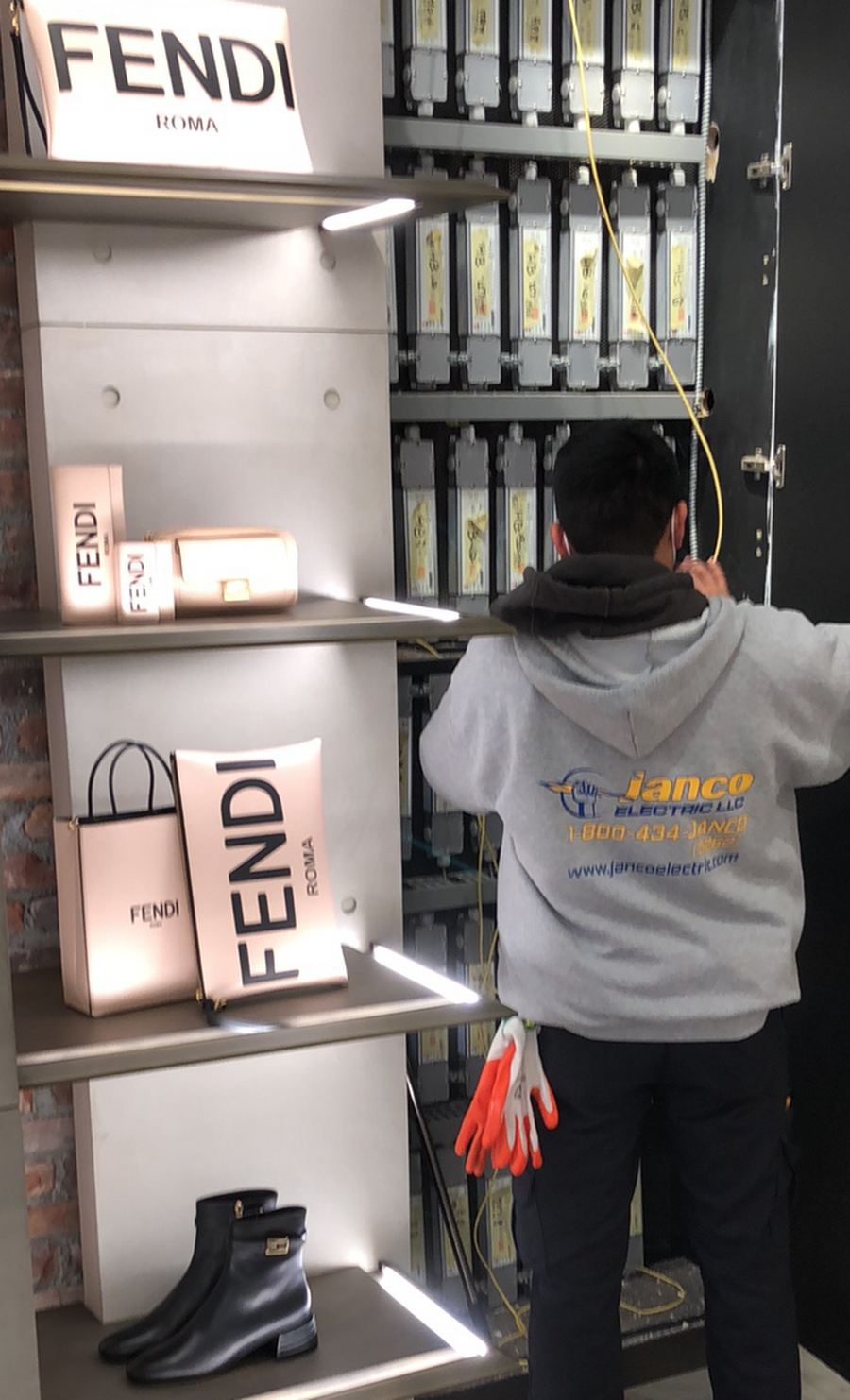 A man standing in front of a fendi store