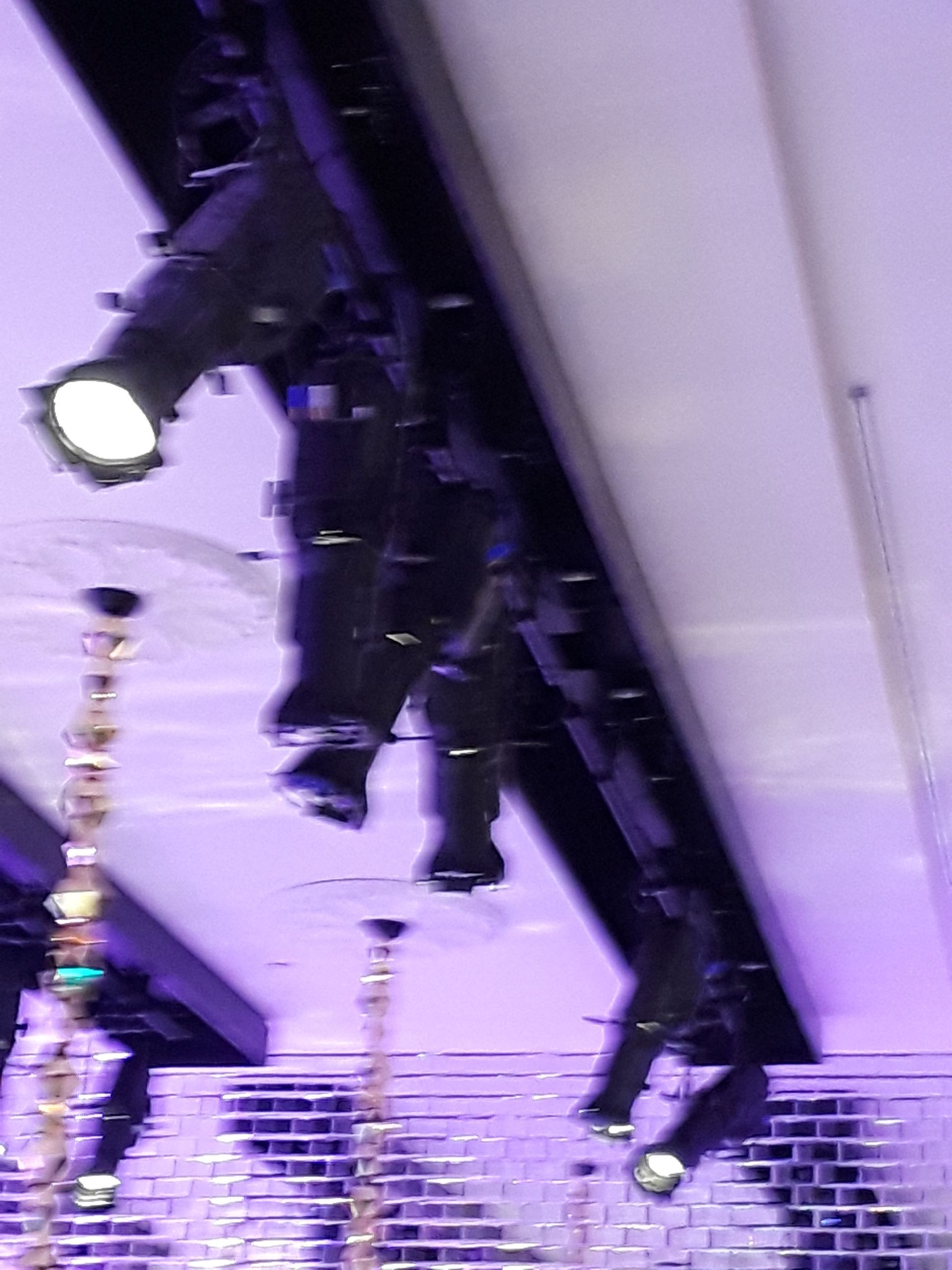 A bunch of lights are hanging from the ceiling in a room.