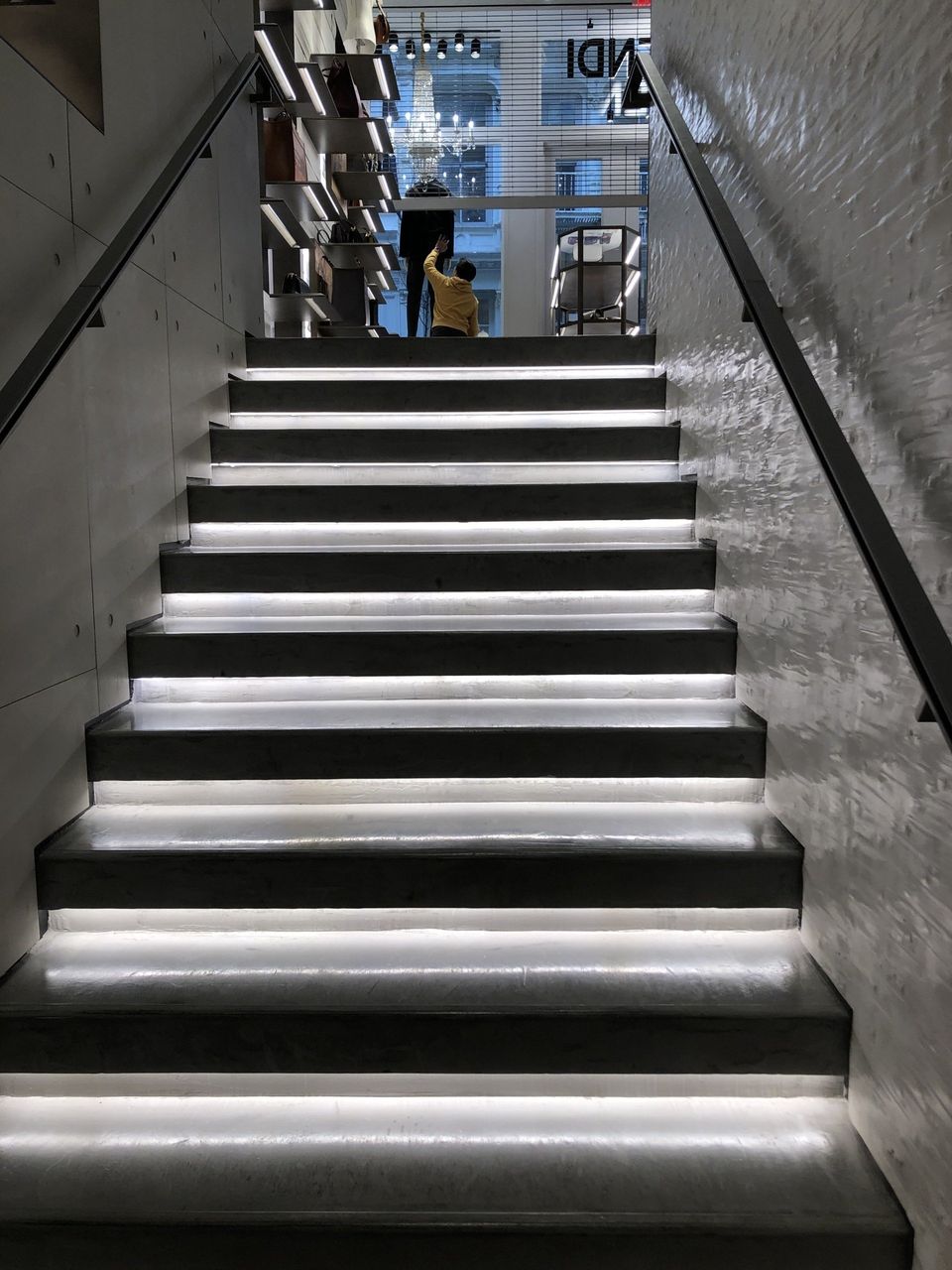A set of stairs that are lit up in a building