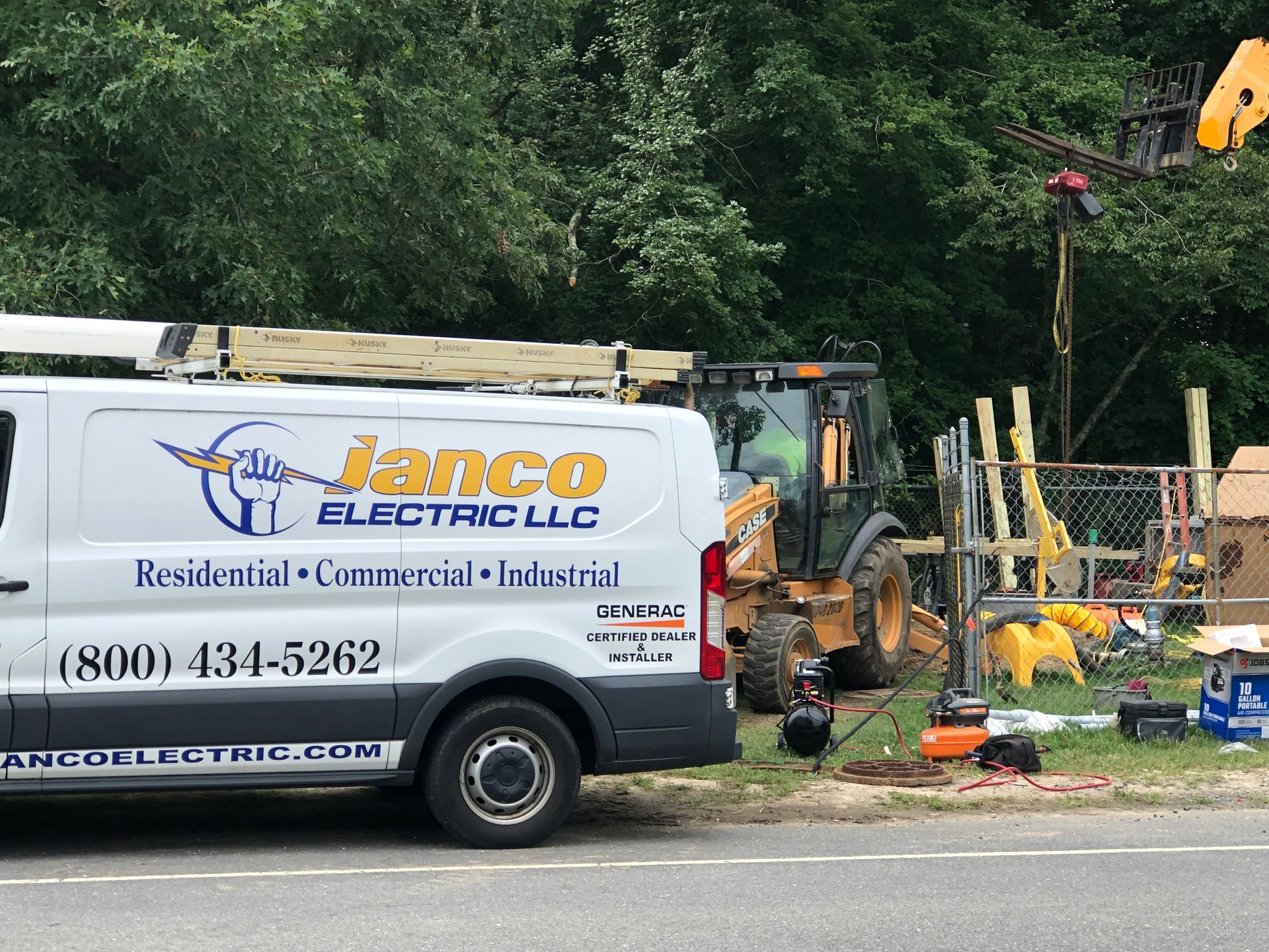 A janco electric llc van is parked on the side of the road