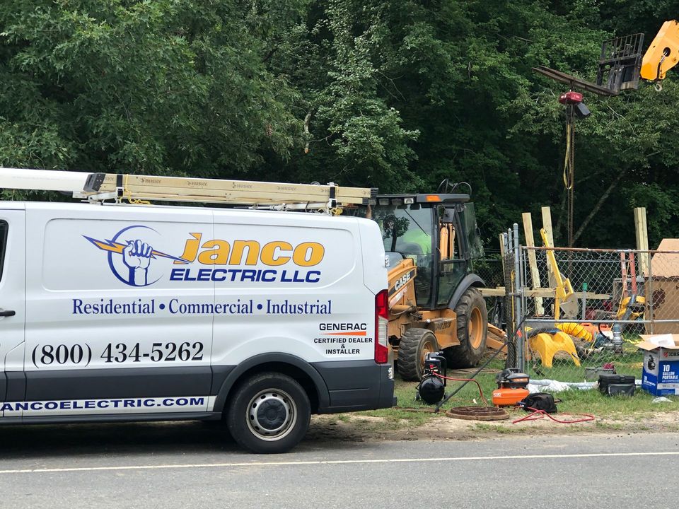 A janco electric llc van is parked on the side of the road