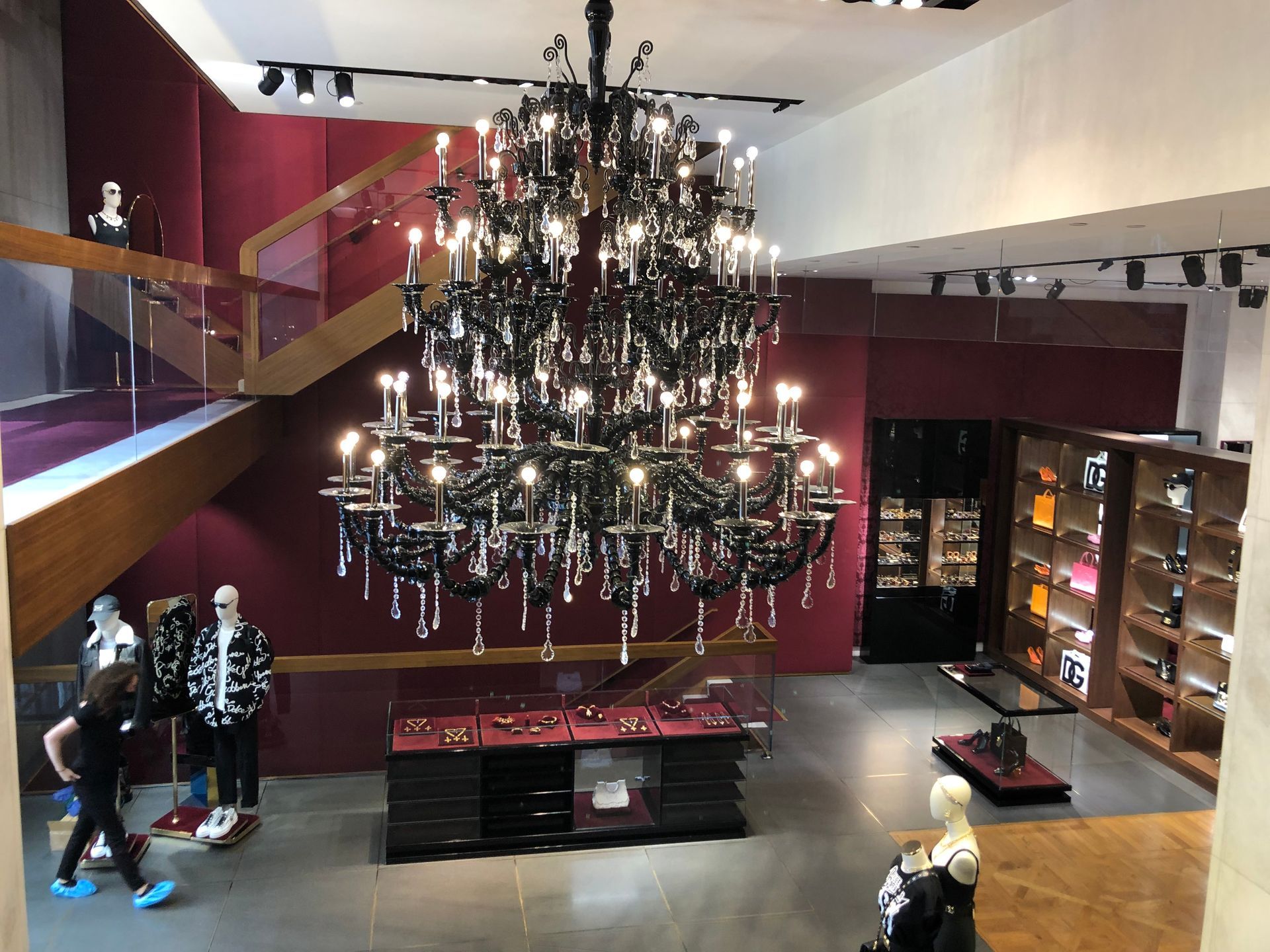 A large chandelier is hanging from the ceiling of a store.