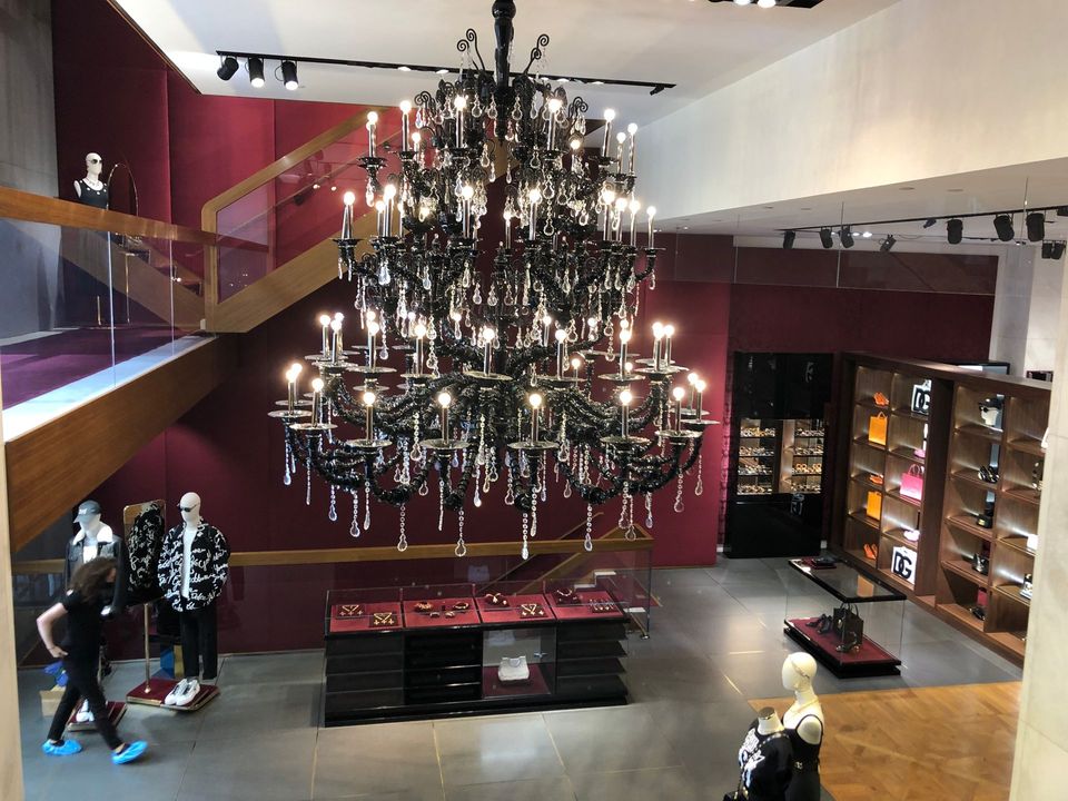A large chandelier is hanging from the ceiling of a store.