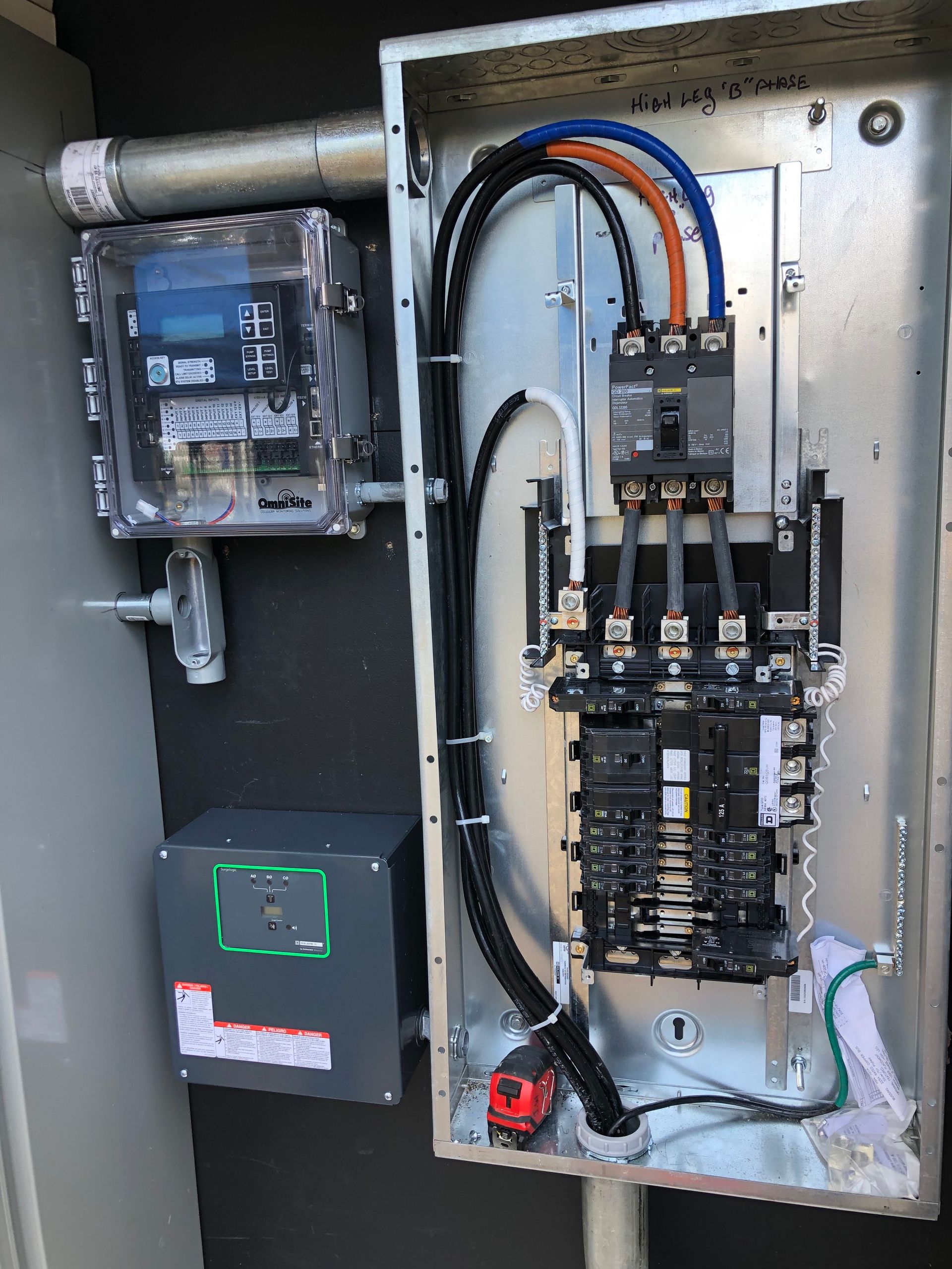 A close up of a electrical box with a meter attached to it.