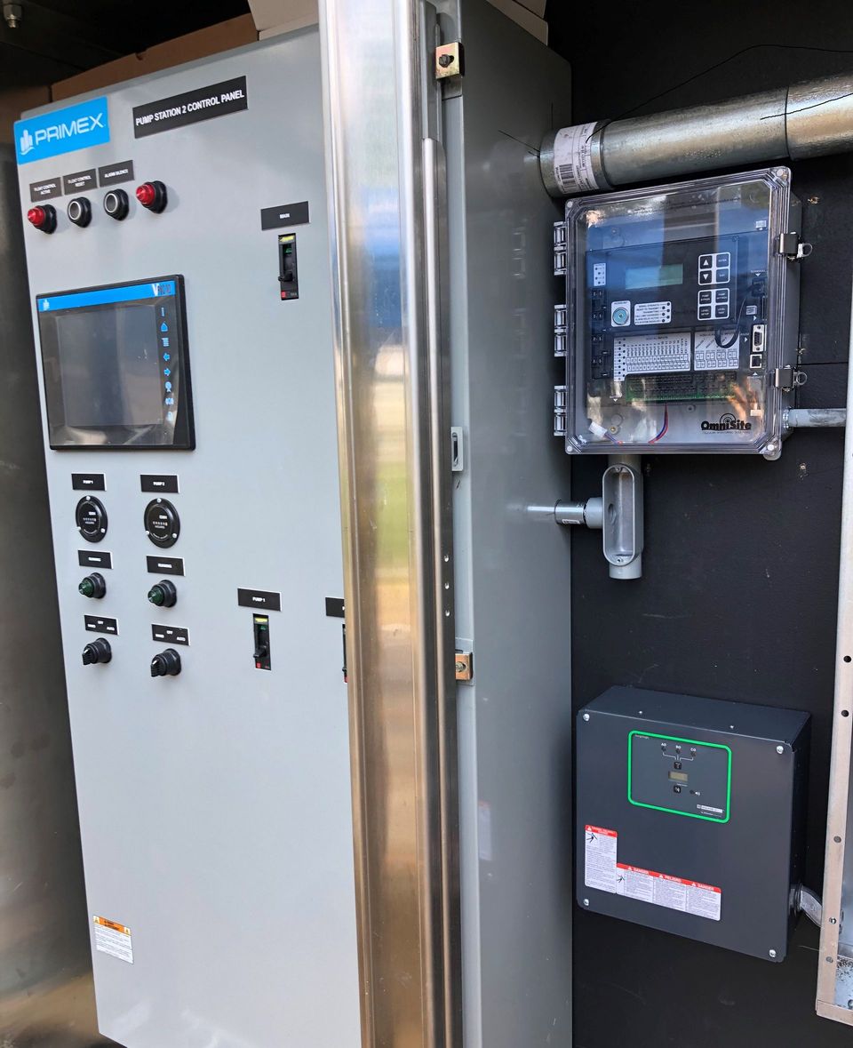 A large electrical box with a monitor on top of it.
