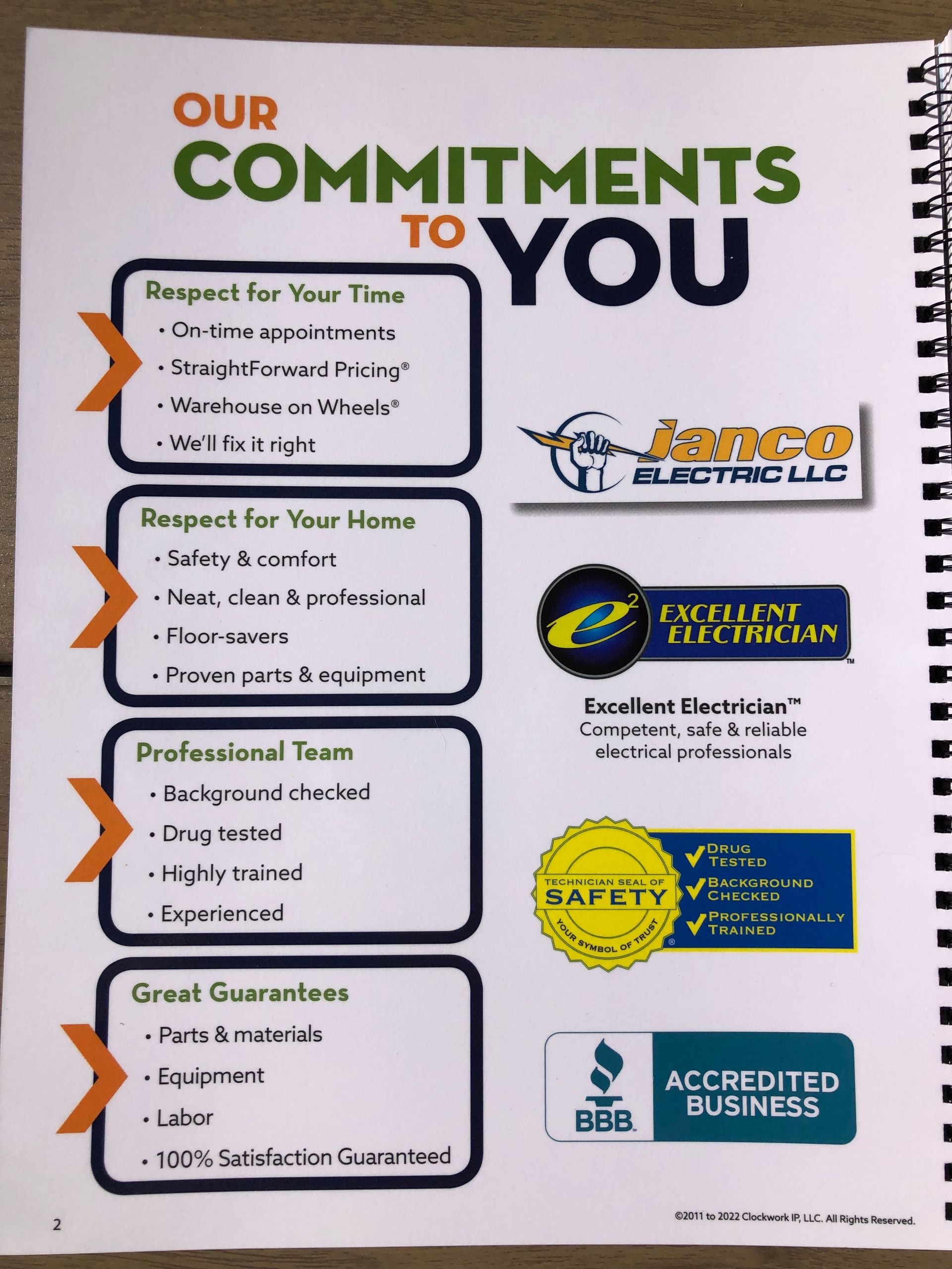 A book is open to a page that says our commitments to you