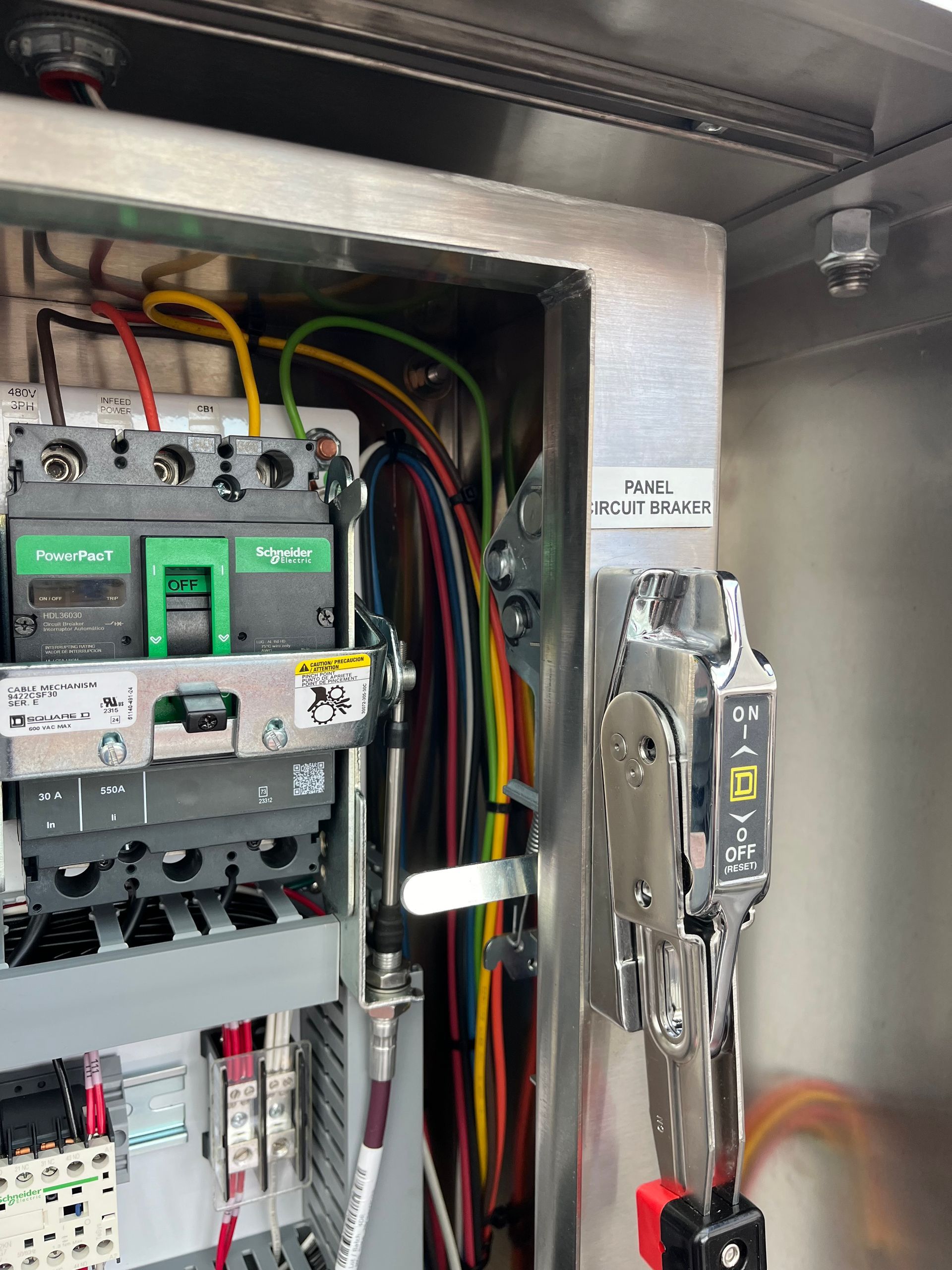A close up of a electrical box with a lot of wires