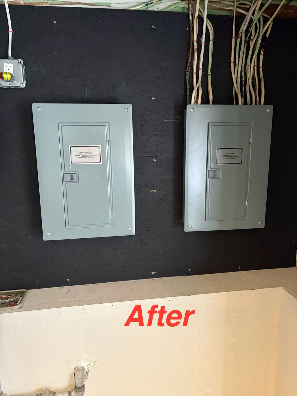 Two gray electrical breaker panels mounted on a black wall, labeled “After.”