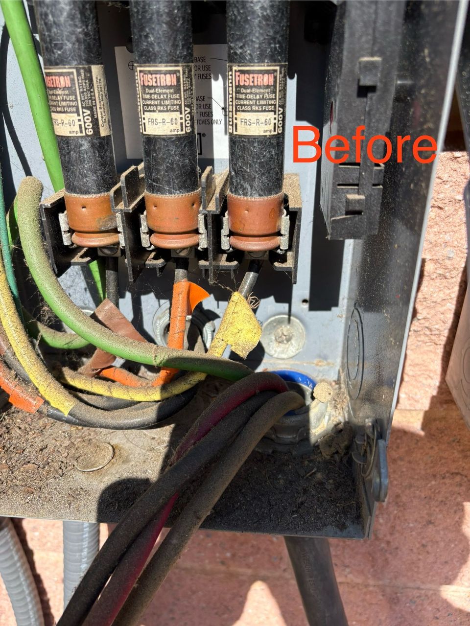 Electrical panel wiring with fuses and colored cables, labeled “Before.”