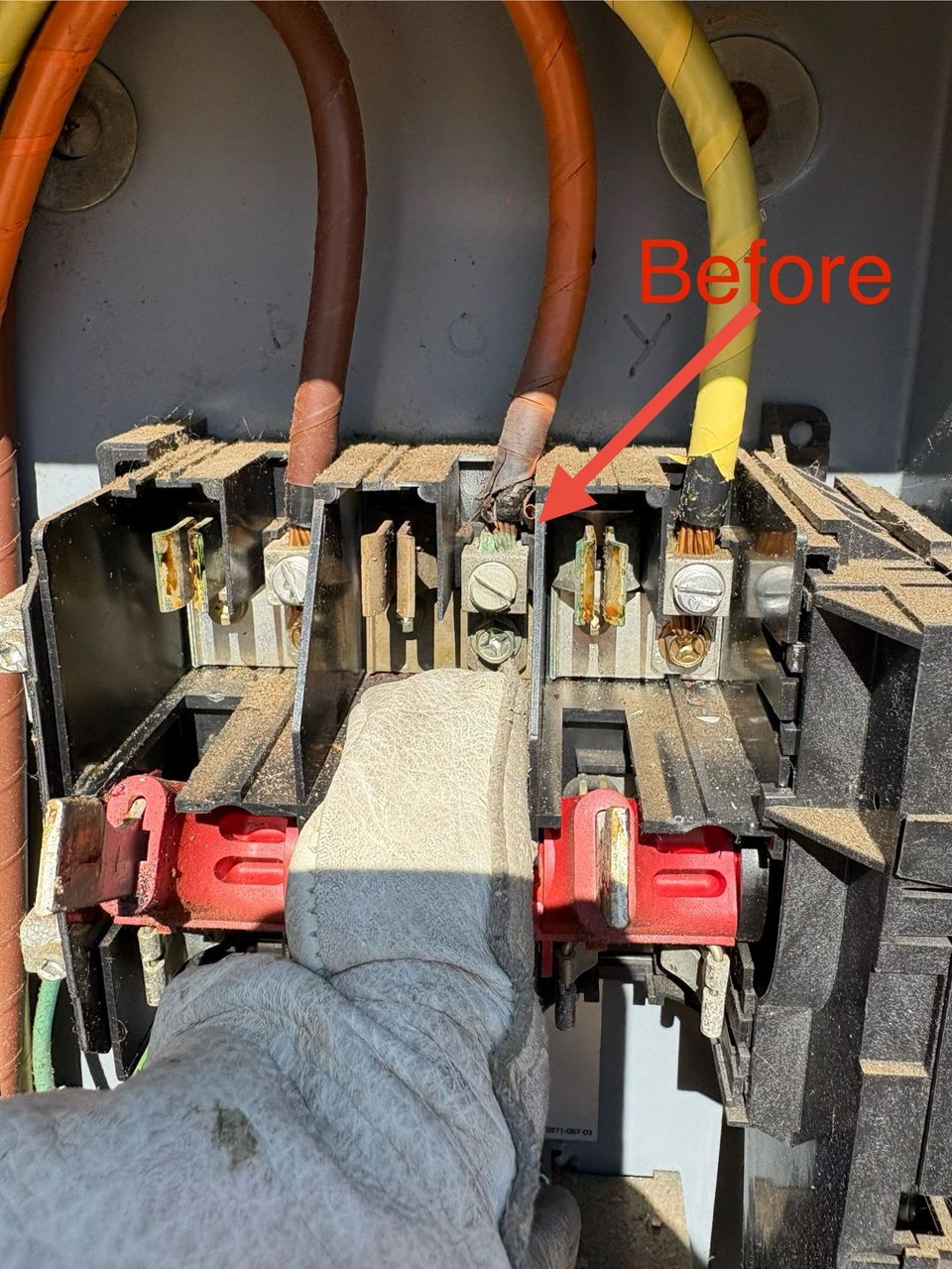 Hand pointing at damaged electrical breaker panel with exposed wiring and red handles, labeled “Before”