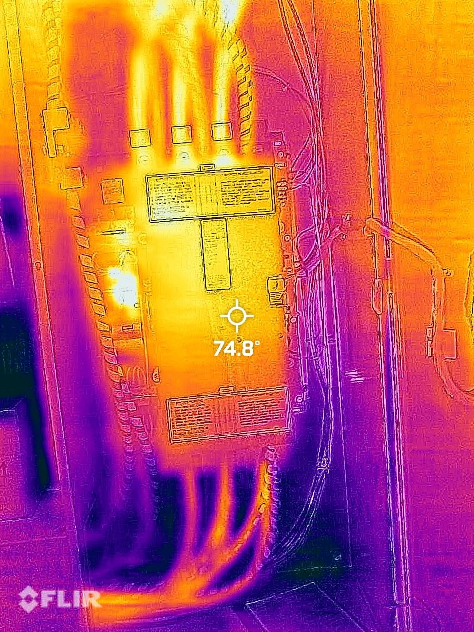 A thermal image of an electrical box with a voltage reading of 74.8.