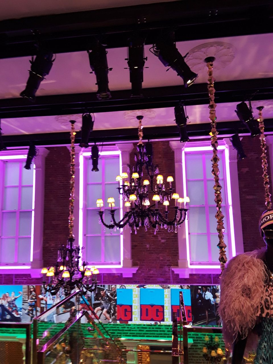 A chandelier is hanging from the ceiling of a room