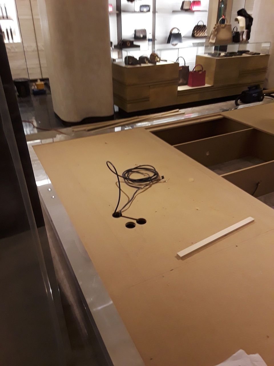 A pair of headphones are laying on a counter in a store