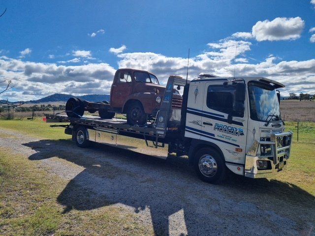 Tow Truck Transporting a White Car — Towing in Kempsey