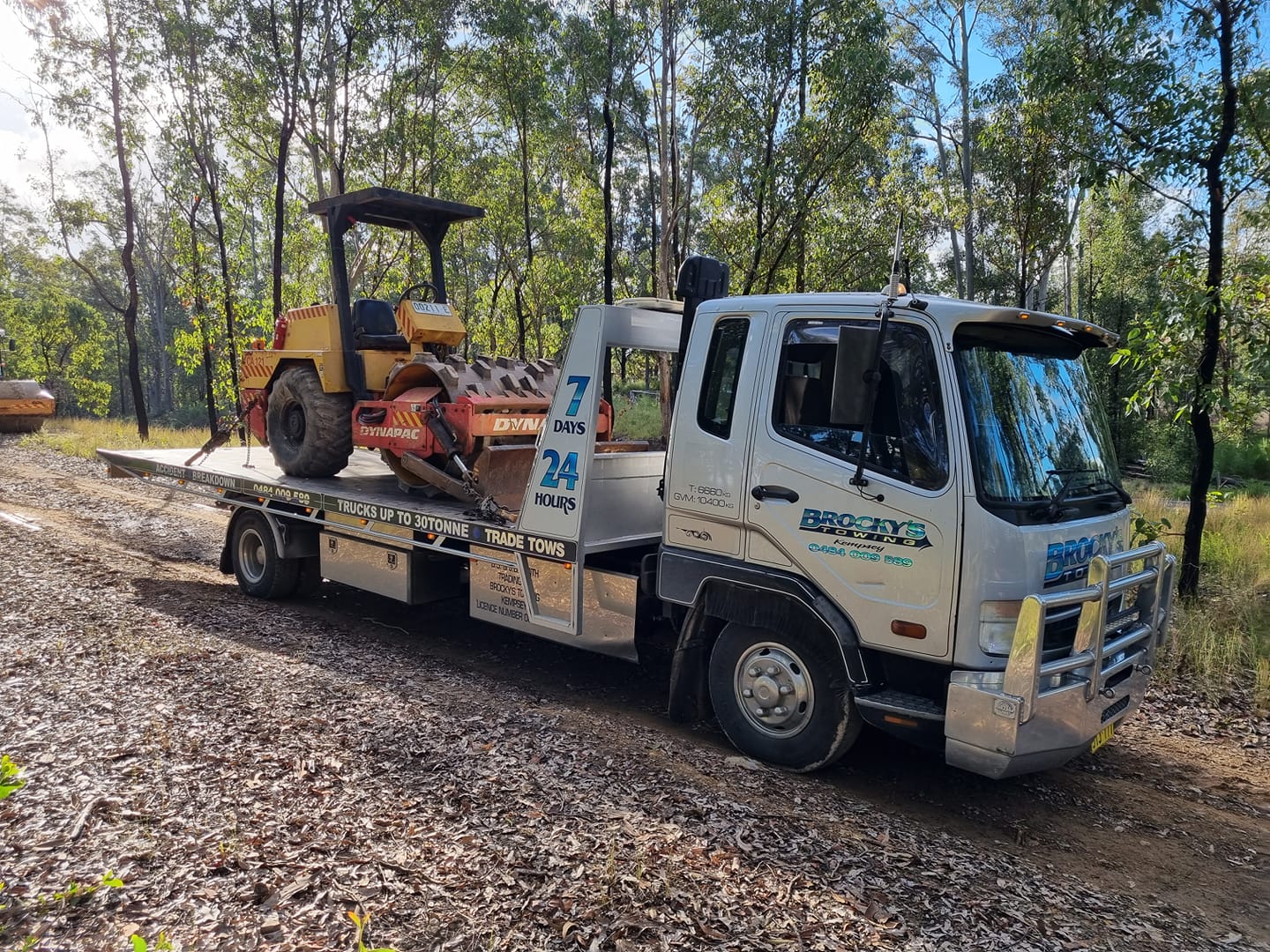 Construction Equipment on the Back of a Tow Truck — Towing in Kempsey