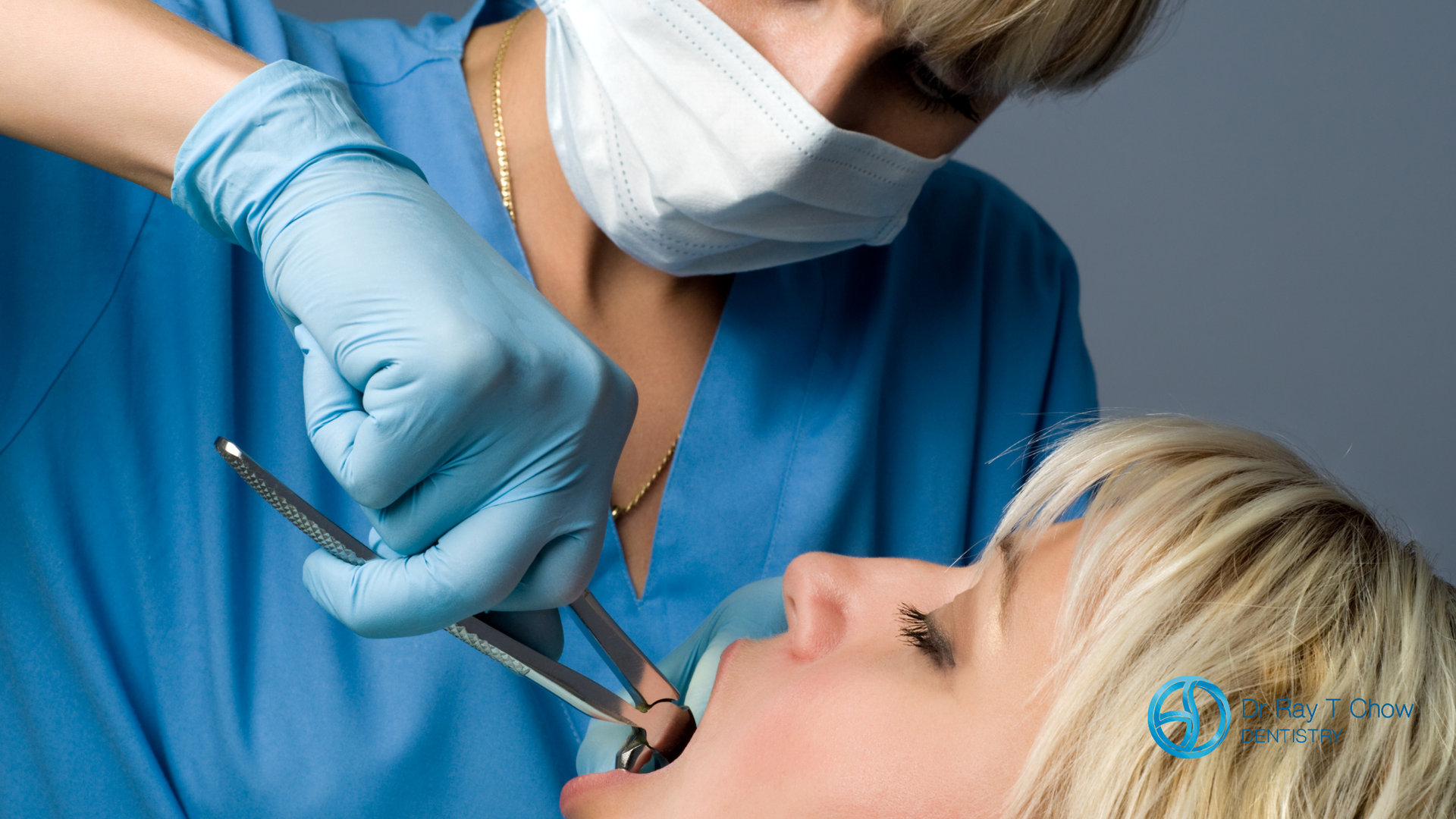 A woman is getting her teeth examined by a dentist