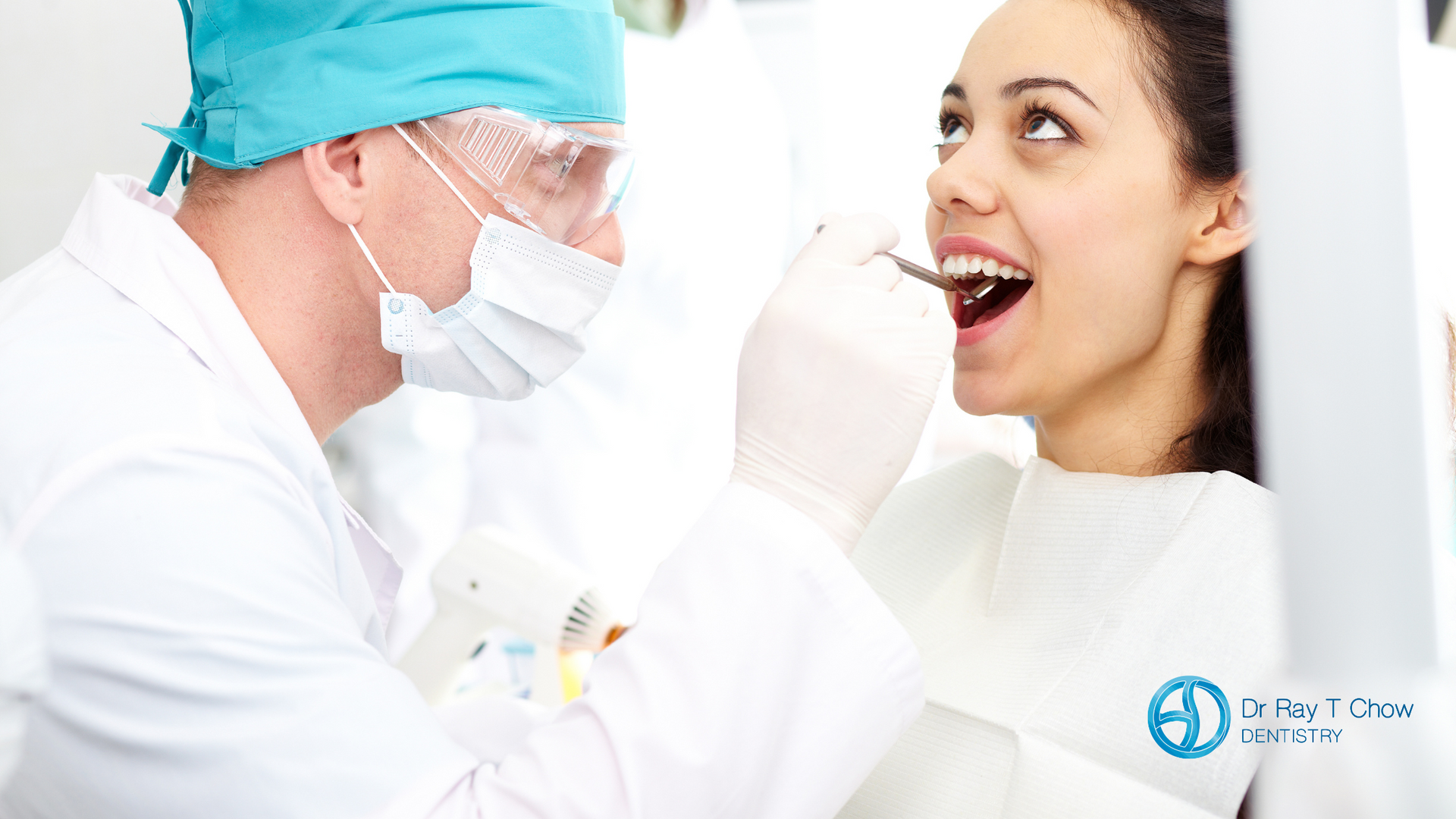 A dentist is examining a woman 's teeth in a dental office.
