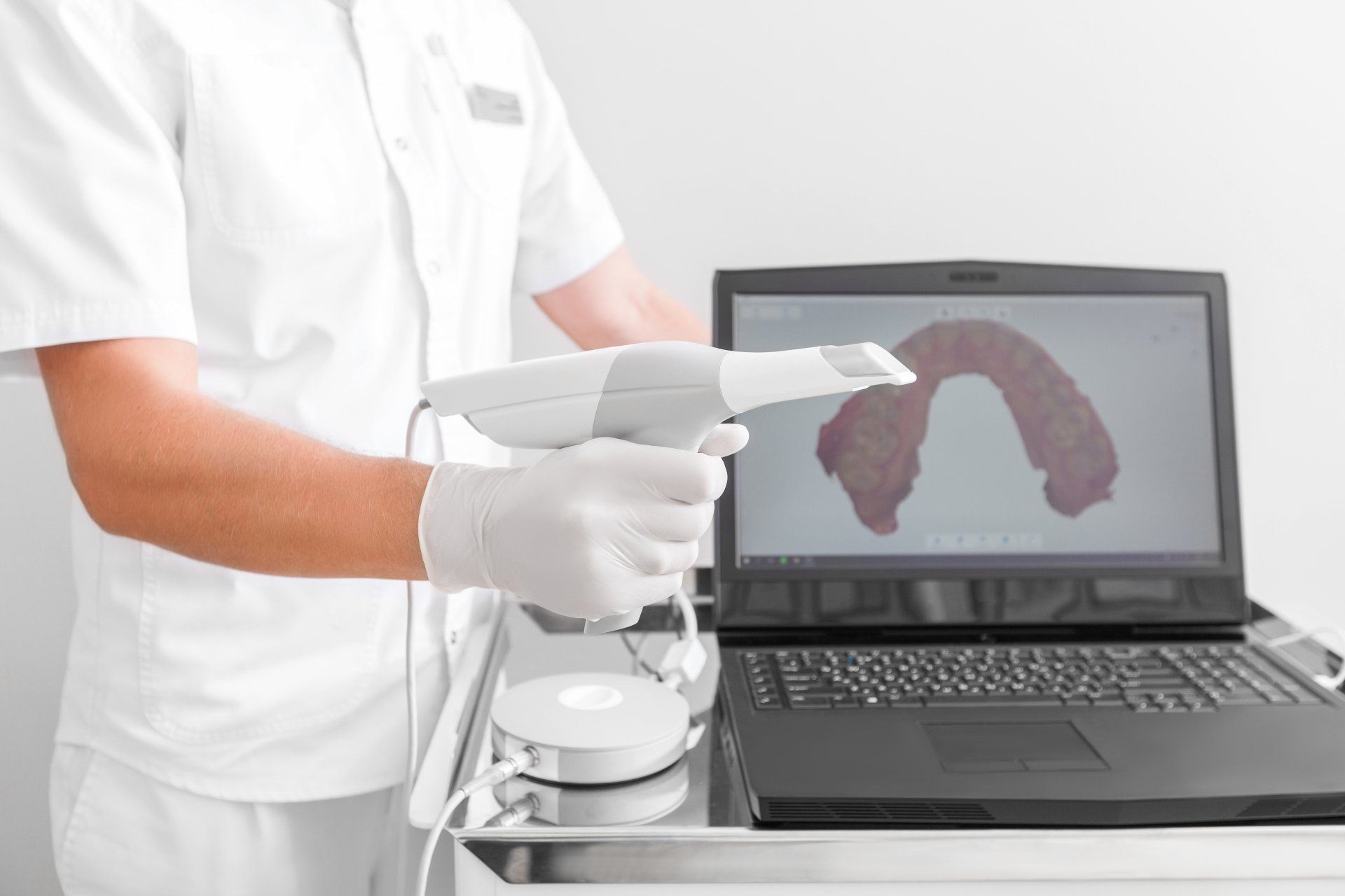 Dental technology | Dental 3D scanner | dentist near you | man holding scanner in front of a computer | Dr. Ray T Chow Dentistry | Victoria Dentist