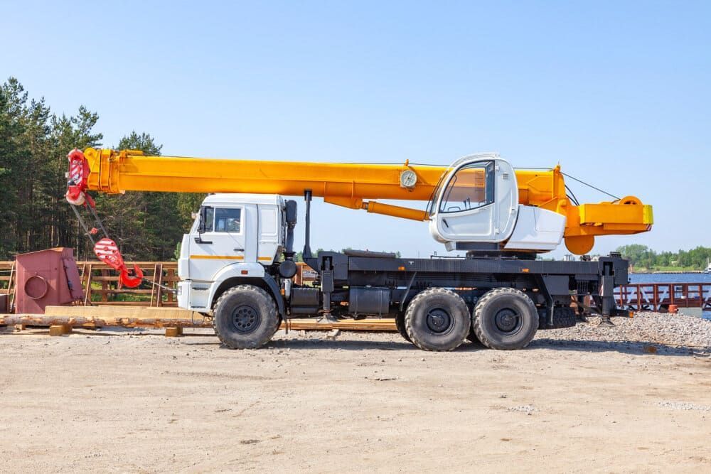 A Yellow Crane Is Parked On The Side Of A Truck — Tyrepower Innisfail In Tully, QLD