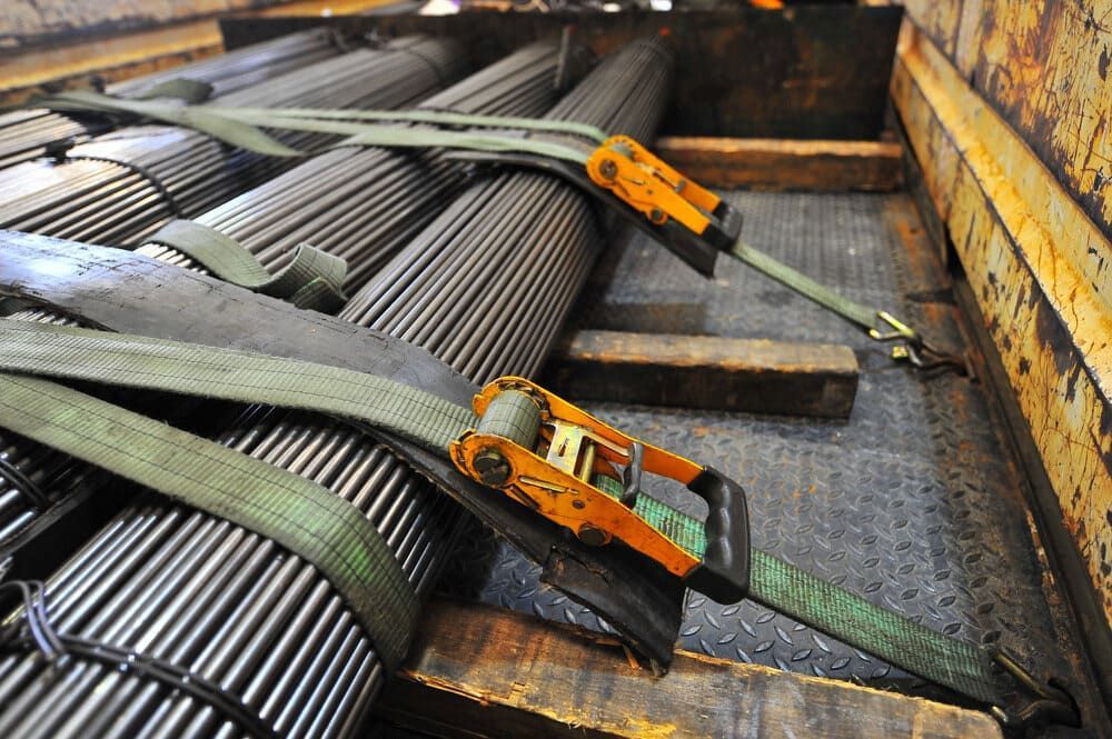 A Bunch Of Metal Pipes Are Tied Together With Straps And A Ratchet — Tyrepower Innisfail In Tully, QLD